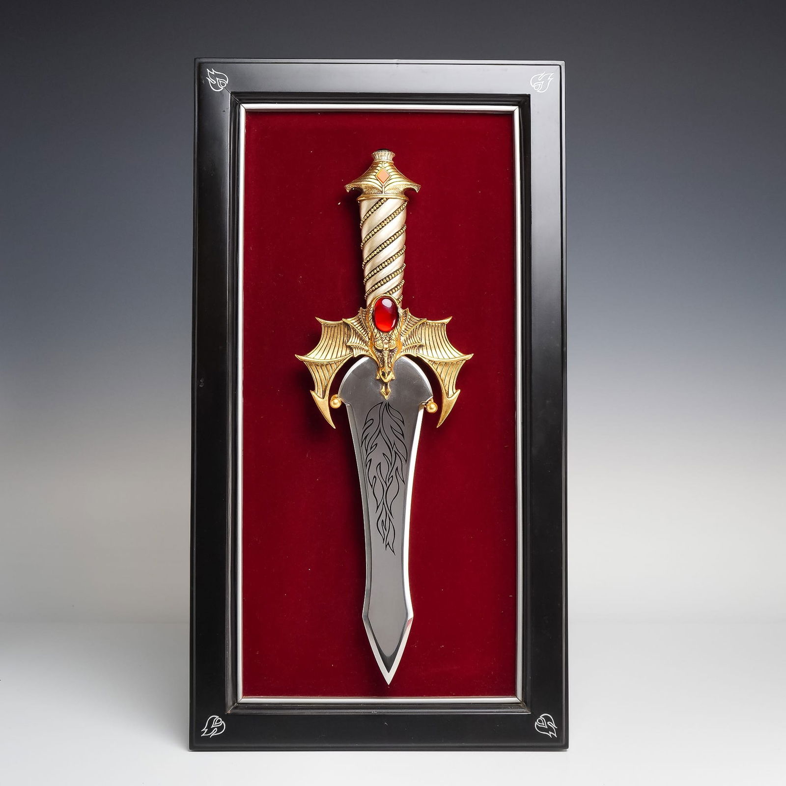 United States, Franklin Mint Dragon's Fire Fantasy Dagger, Late 20th Century: This is a decorative fantasy dagger titled Dragon's Fire, manufactured by the Franklin Mint and designed by artist Greg Hildebrandt. The item features a leaf-shaped stainless steel blade embellished w