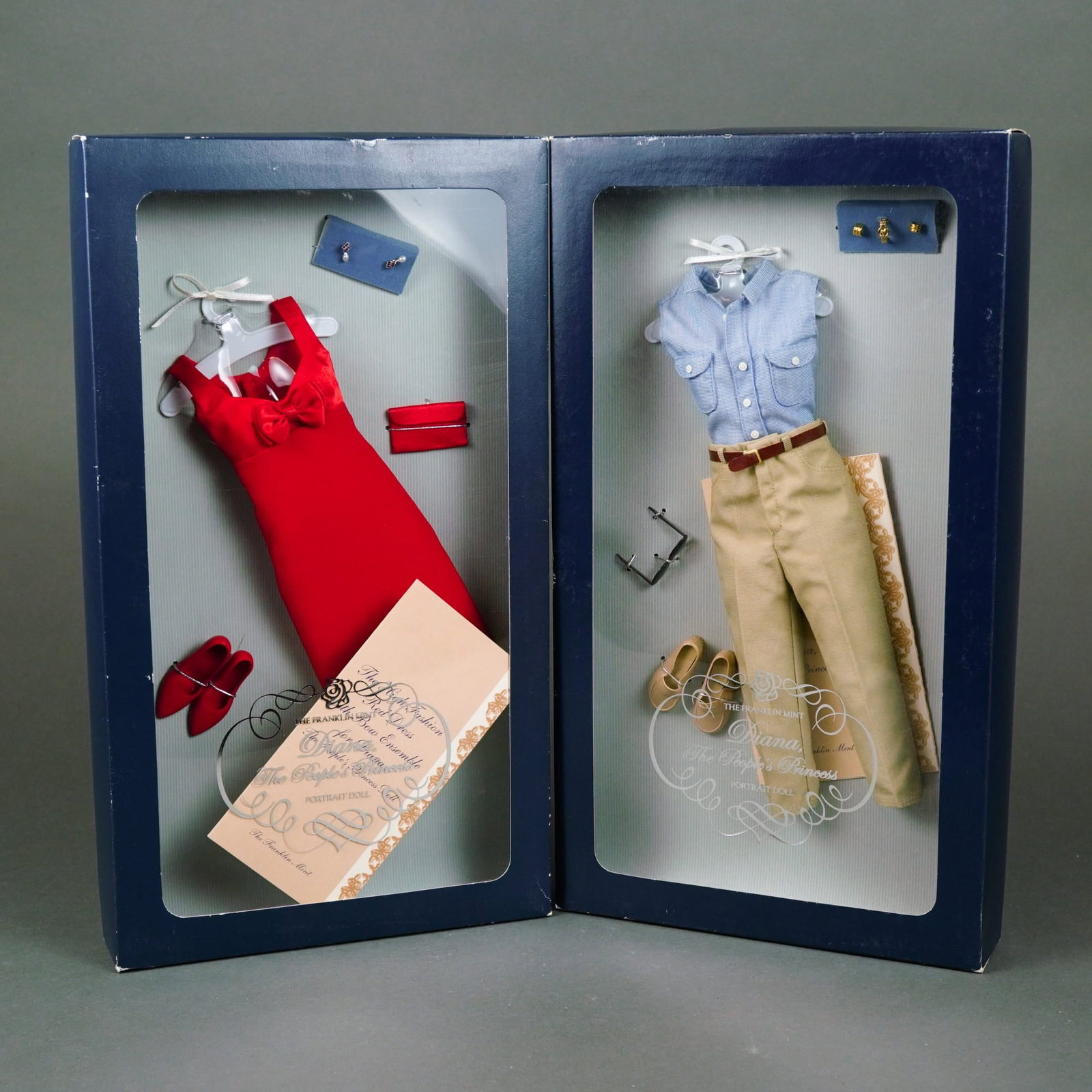 The Franklin Mint, Diana, The People's Princess Portrait Doll Ensembles, 16 Inches: A pair of original outfit and accessory ensembles manufactured by The Franklin Mint for the Diana, The People's Princess Portrait Doll. The first set, titled "The High Fashion Red Dress Bow Ensemble,"