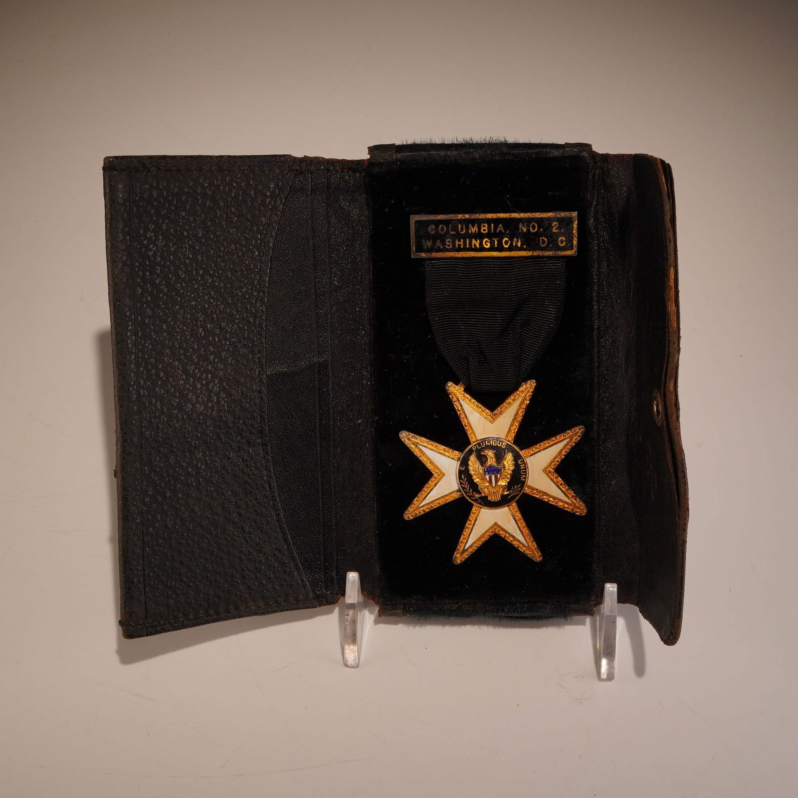 Masonic Knights Templar Enamel Maltese Cross Insignia by CC Rhay: A vintage Masonic Knights Templar medal assembly, encased in a genuine cowhide leather presentation case. The insignia features an eight-pointed Maltese cross constructed of gilt-metal and white ename