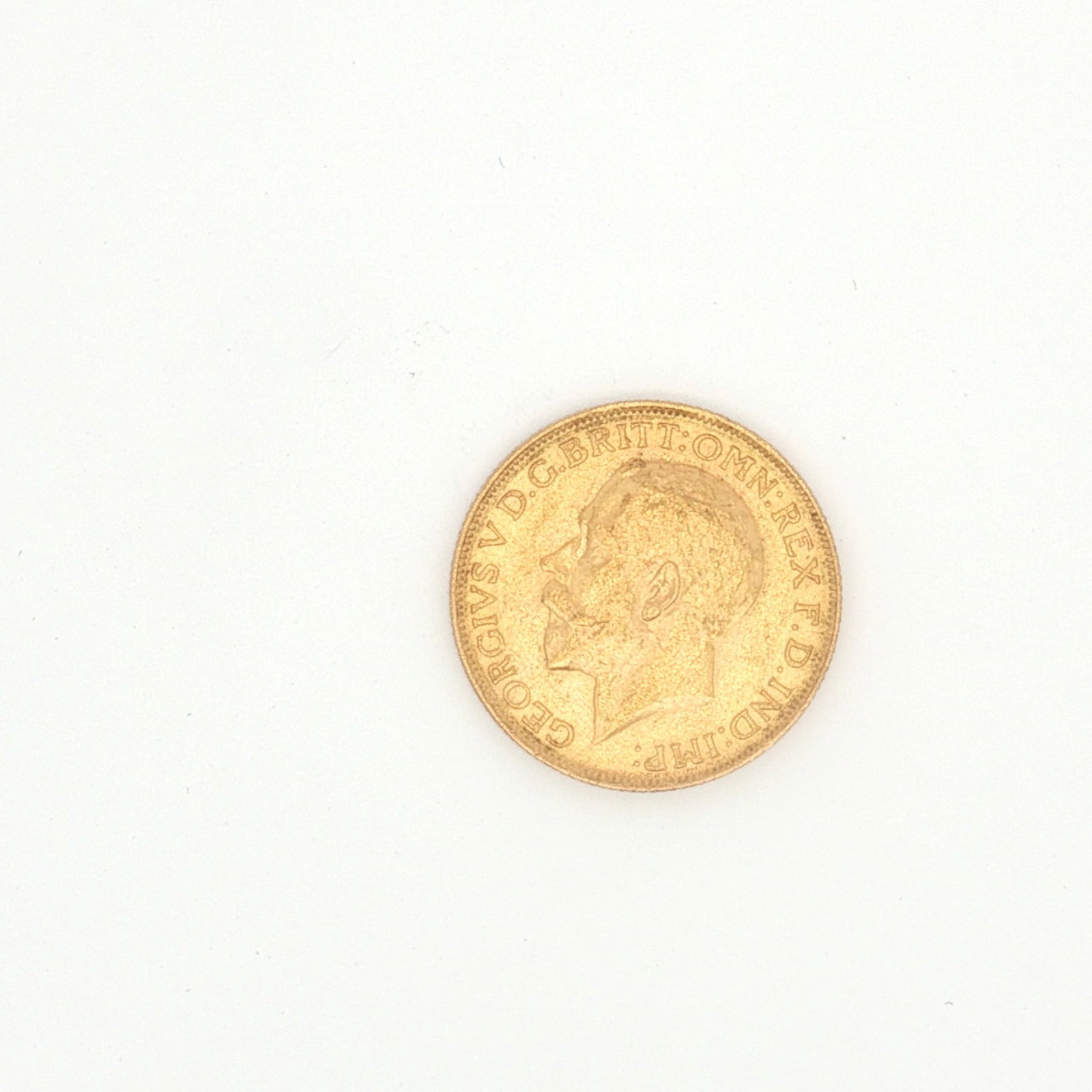 1928 UK 1 Sovereign King George V Gold Coin: Minted by the Royal Mint. The obverse side depicts the uncrowned portrait of King George V facing left, legend around. The reverse side depicts St. George on horseback slaying the dragon right. Gold c