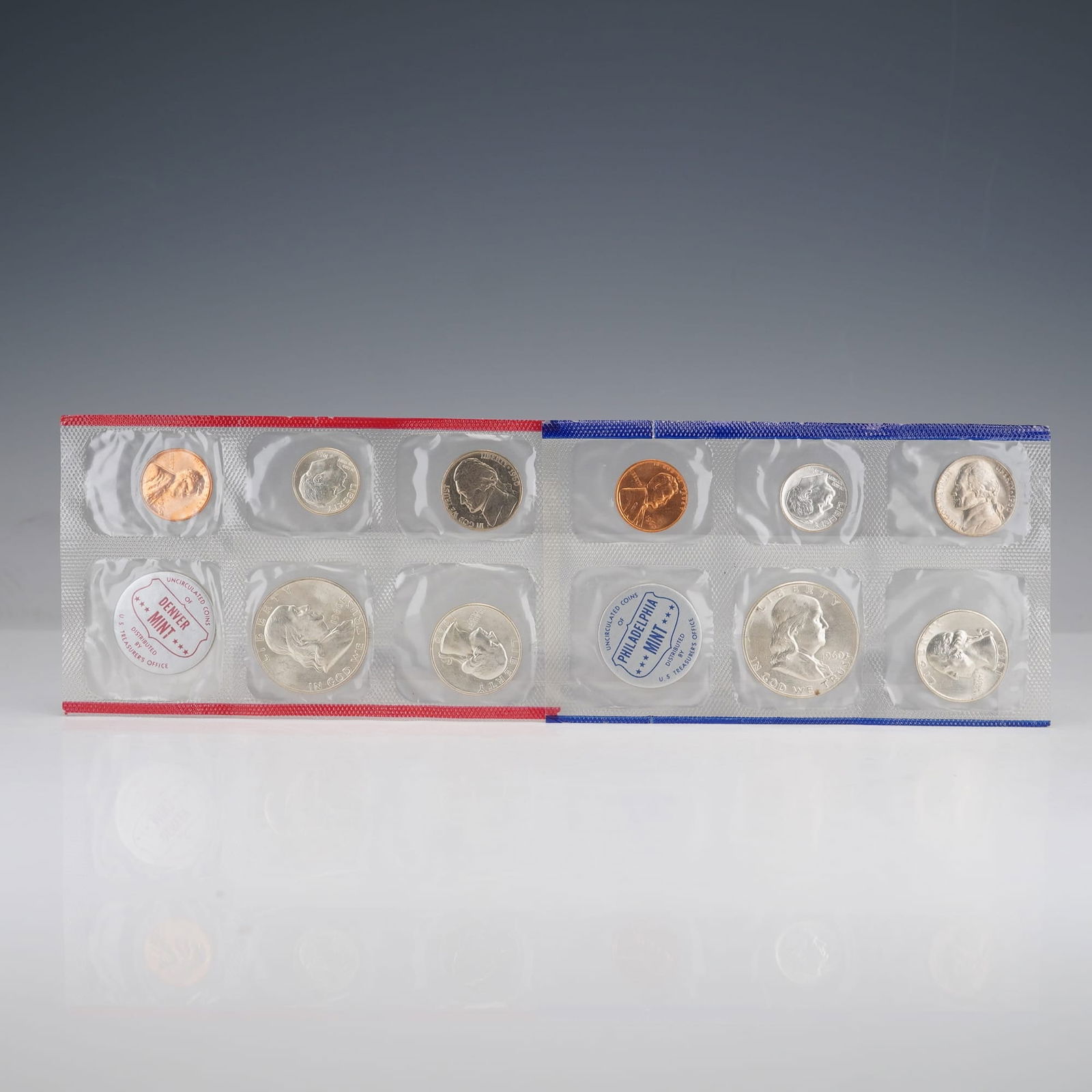 2pc 1960 United States Mint Proof Coin Sets: This 1960 United States Mint Uncirculated Coin Set comprises two complete assortments of coins representing both the Philadelphia and Denver Mints. Each set includes the Lincoln cent, Jefferson nickel