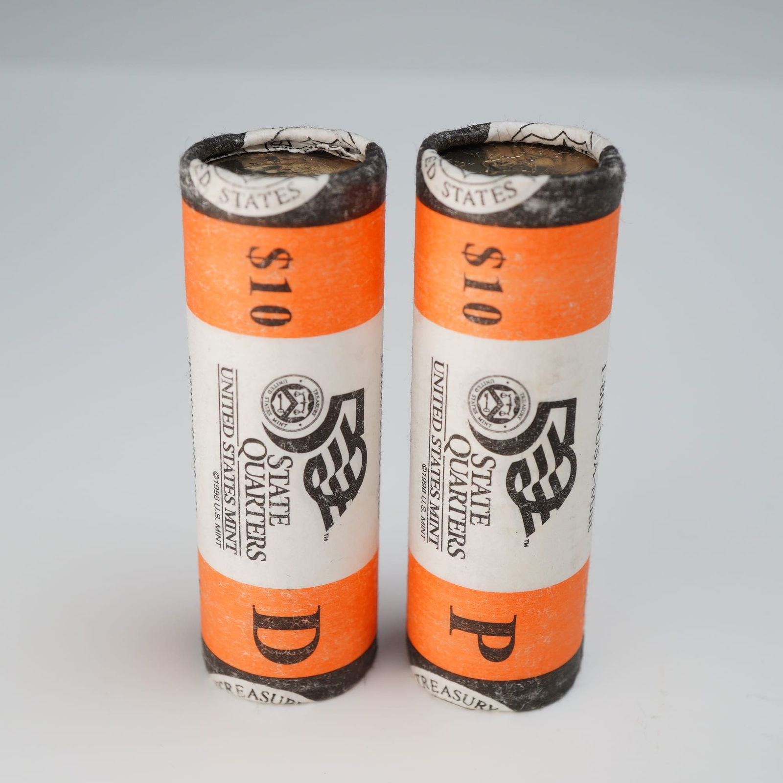 Two 2003D & P U.S. Mint $10 Roll Illinois State Quarters: Minted by Denver and Philadelphia. The obverse depicts left profile of George Washington and is accompanied with the motto: "IN GOD WE TRUST" and surrounded with the lettering: "LIBERTY". The reverse