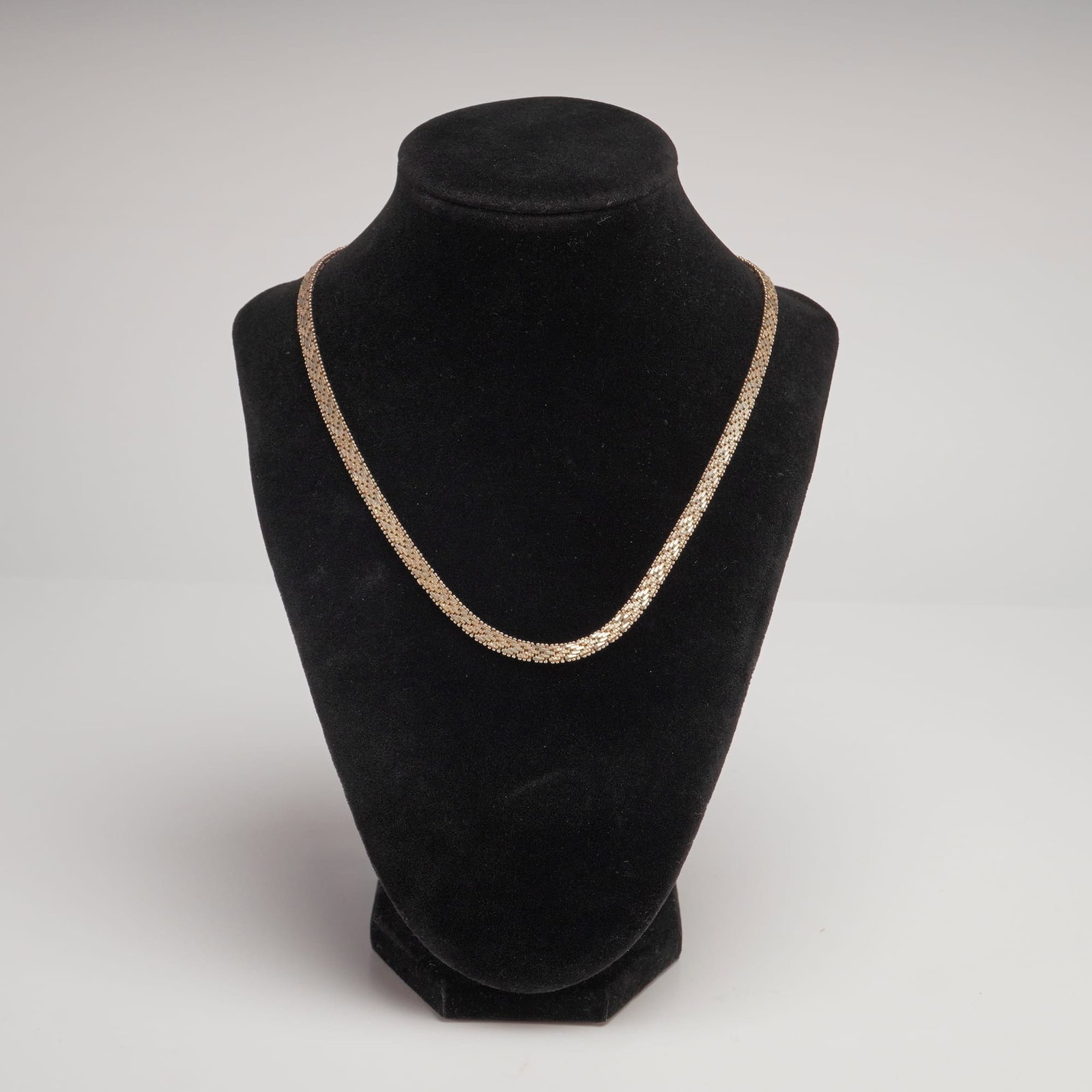 Italian Vermeil Sterling Silver Chain Necklace with Panther Link Design: This Italian sterling silver chain necklace features a gold-tone vermeil finish. The piece is crafted in a wide, flat panther or brick-link style, consisting of five rows of interlocking rectangular l