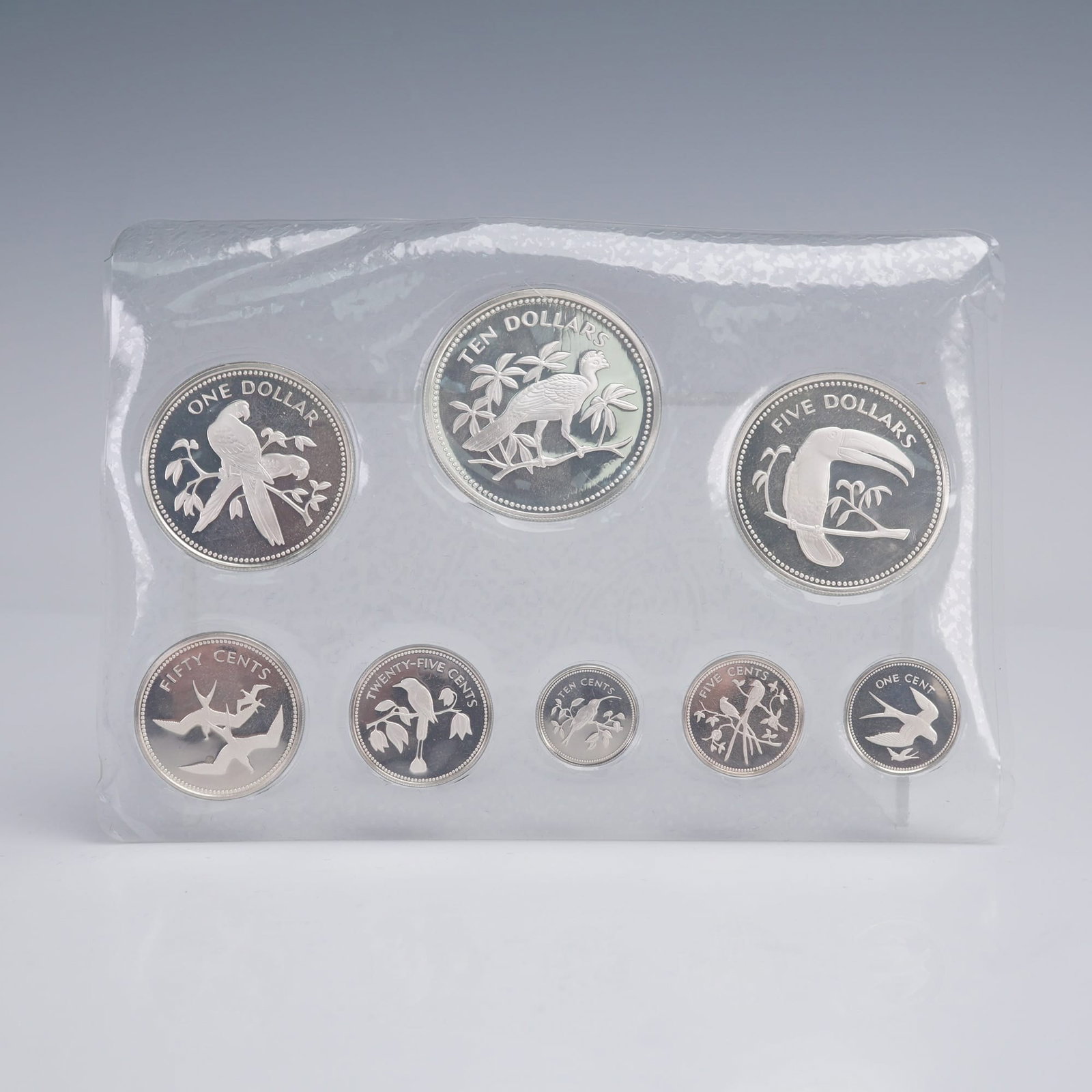 1974 Franklin Mint Coinage of Belize Silver Coin Set: Produced by The Franklin Mint under authorization of the Government of Belize. The set comprises eight coins ranging from one cent to ten dollars, each struck in solid sterling silver (.925 fine). The