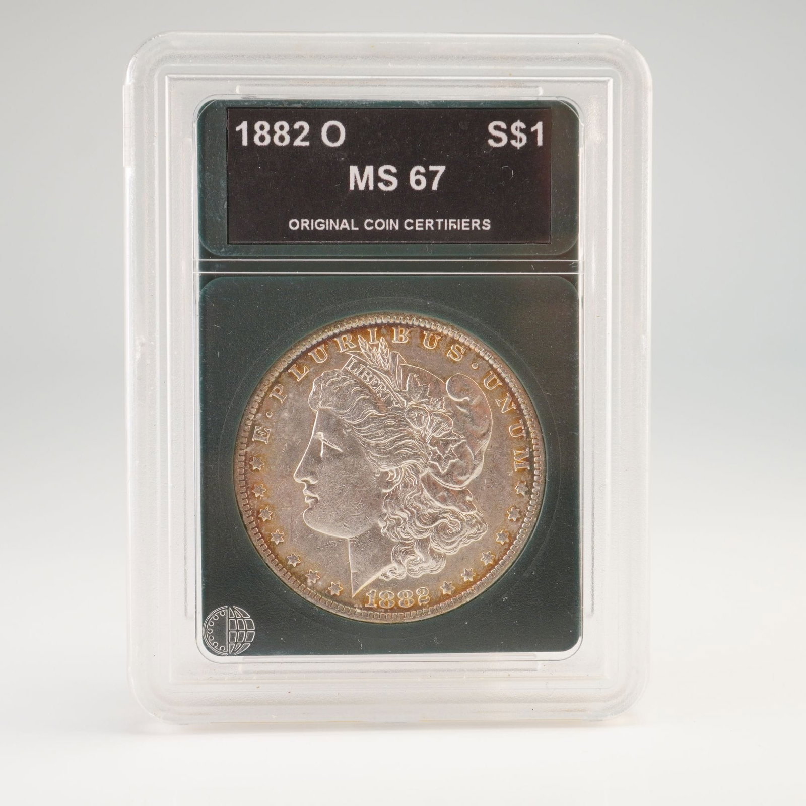 1882-O US Morgan Dollar Silver Coin OCC Graded MS67: Struck at the New Orleans Mint, this Morgan Dollar features the Liberty head on the obverse, facing left, and the eagle clutching arrows and an olive branch within a wreath on the reverse. Composed of