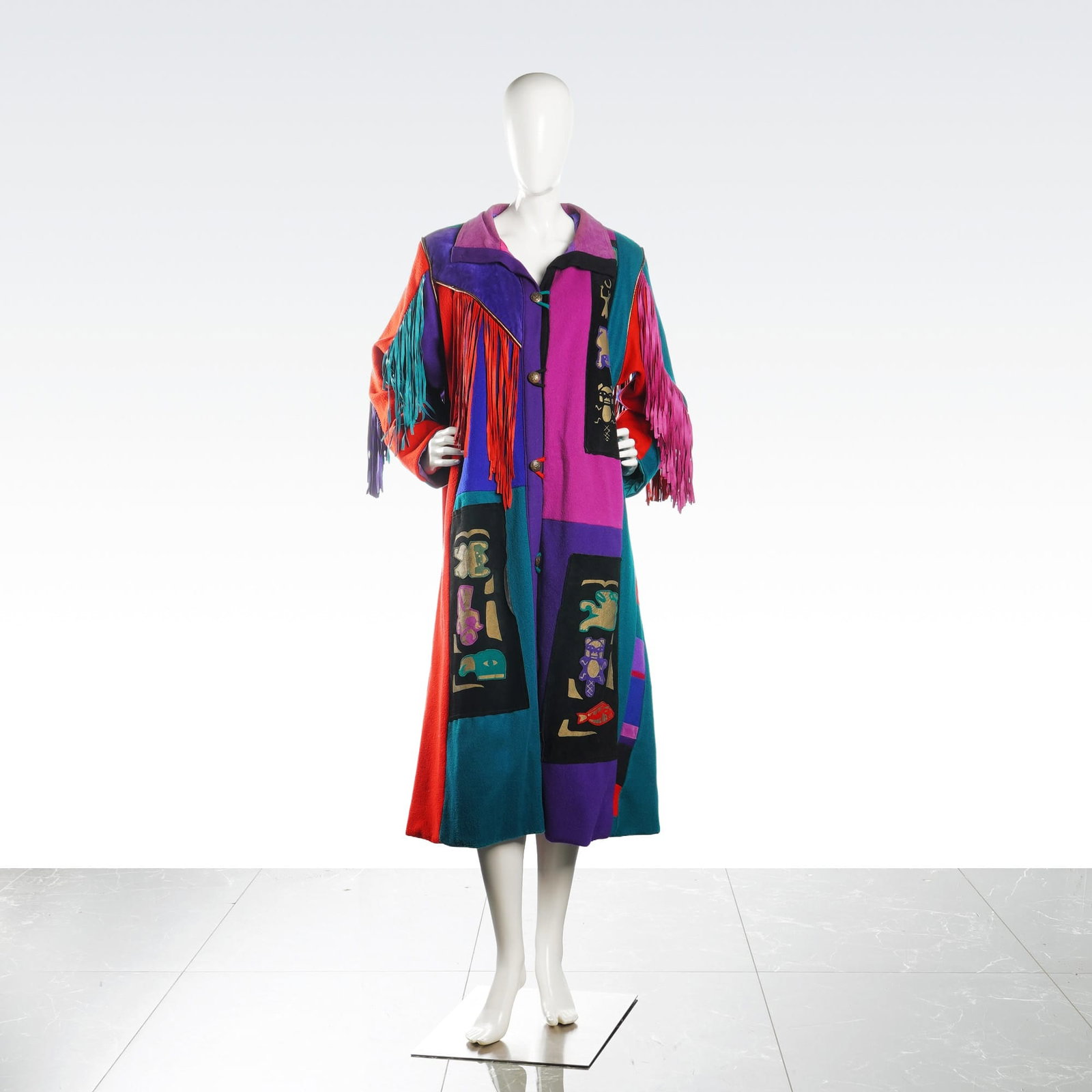 SFR Santa Fe Re-Creations Patchwork Fringe Suede Long Coat: A duster-style long coat by SFR Santa Fe Re-Creations of Denver featuring a Southwest-inspired patchwork design. The garment is constructed from a multi-material blend including wool, cotton, leather,