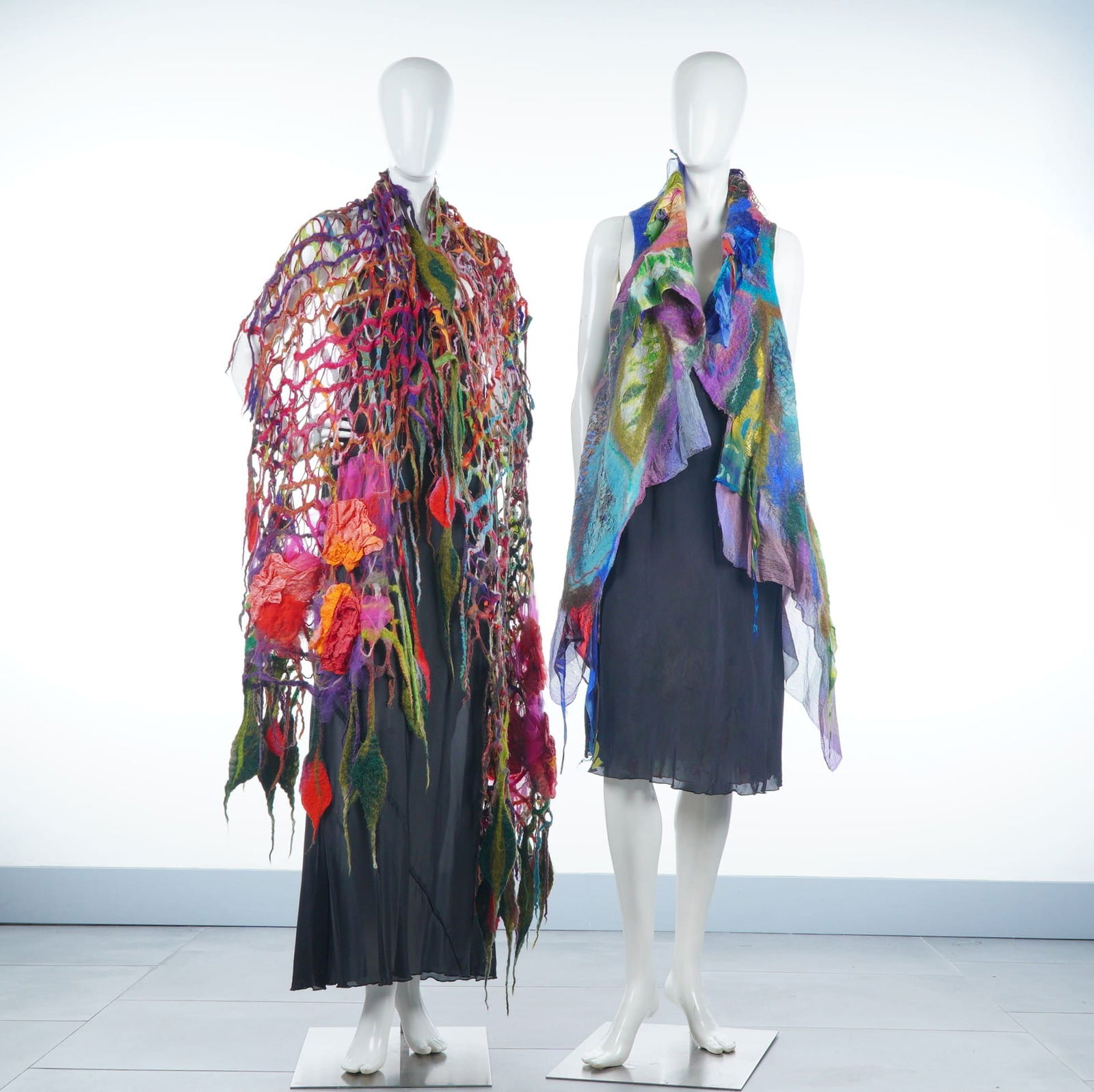 2pc Galina Kostanda Sleeveless Batik Coat & Fiber Art Shawl: This lot features two unique, handcrafted wearable fiber art pieces by designer Galina Kostanda. The first item is a multi-colored open-grid shawl constructed using nuno felting techniques, merging wo
