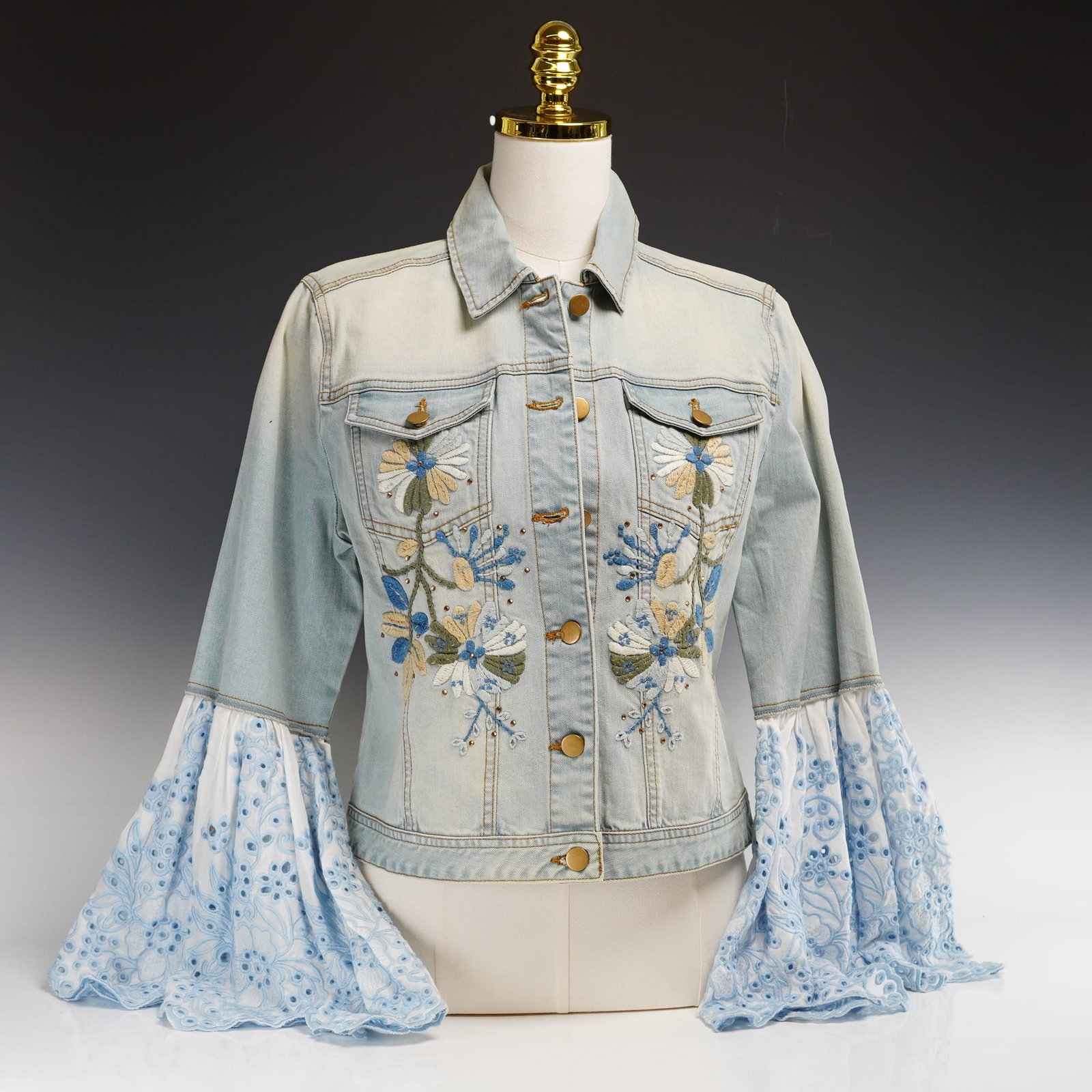 Boston Proper Embroidered Denim Jacket with Eyelet Bell Sleeves, Size M: This bohemian-inspired denim jacket from Boston Proper features a light wash finish and intricate floral embroidery. The front panels are decorated with stylized botanical motifs in shades of cornflow