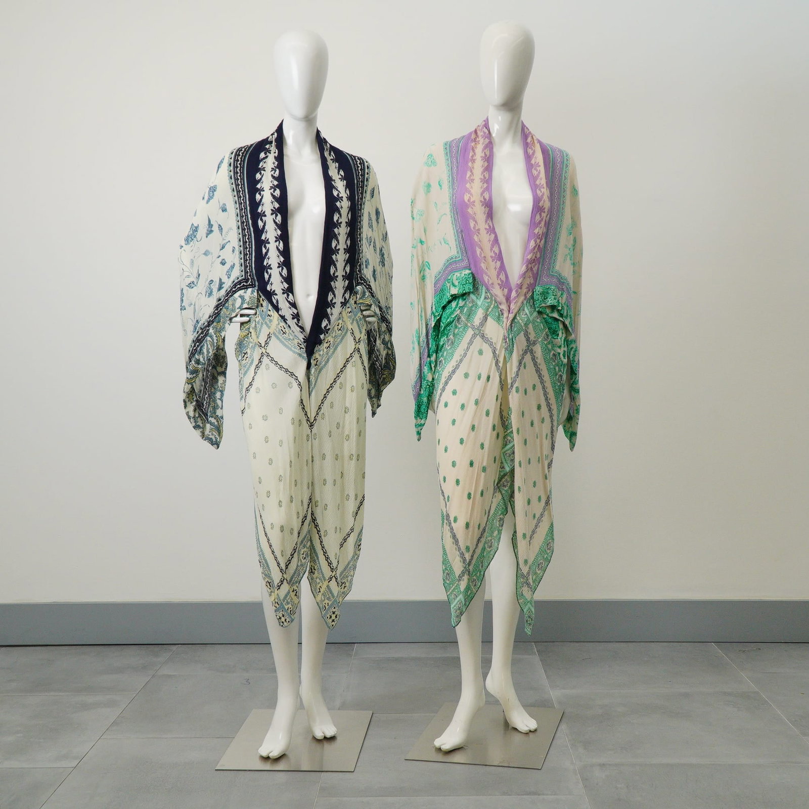 2pc Free People Kiss the Sky Butterfly Floral & Paisley Kimonos: A pair of Free People Kiss the Sky Butterfly kimonos. These lightweight, open-front garments are constructed from a printed fabric featuring allover floral, paisley, and geometric motifs on a cream-co