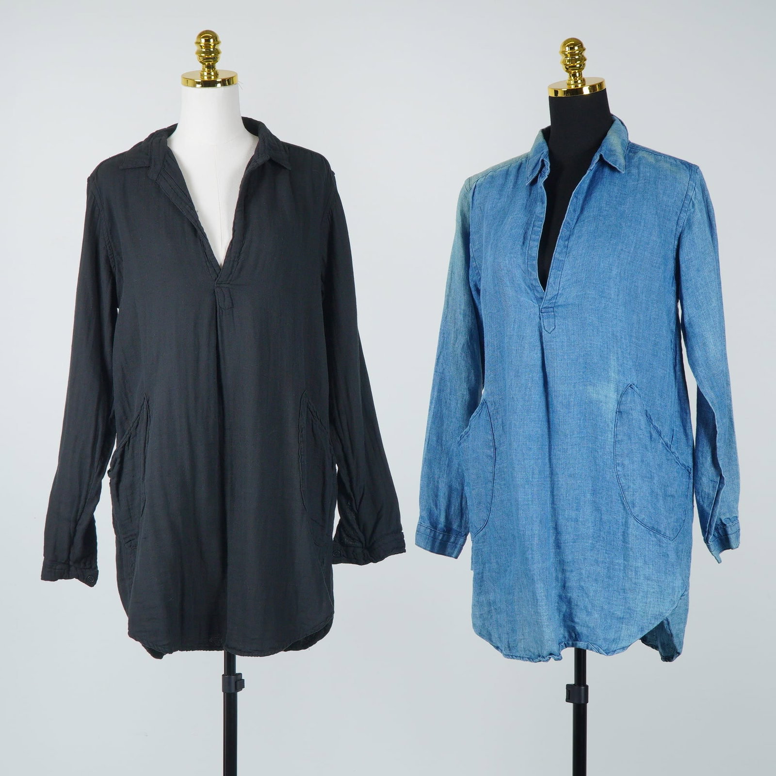 2pc CP Shades Black and Blue Teton Linen Tunics: This lot features two CP Shades Teton longline tunics crafted from lightweight, textured linen. The set includes one solid black tunic and one in a medium blue denim-look wash. Each garment is designe