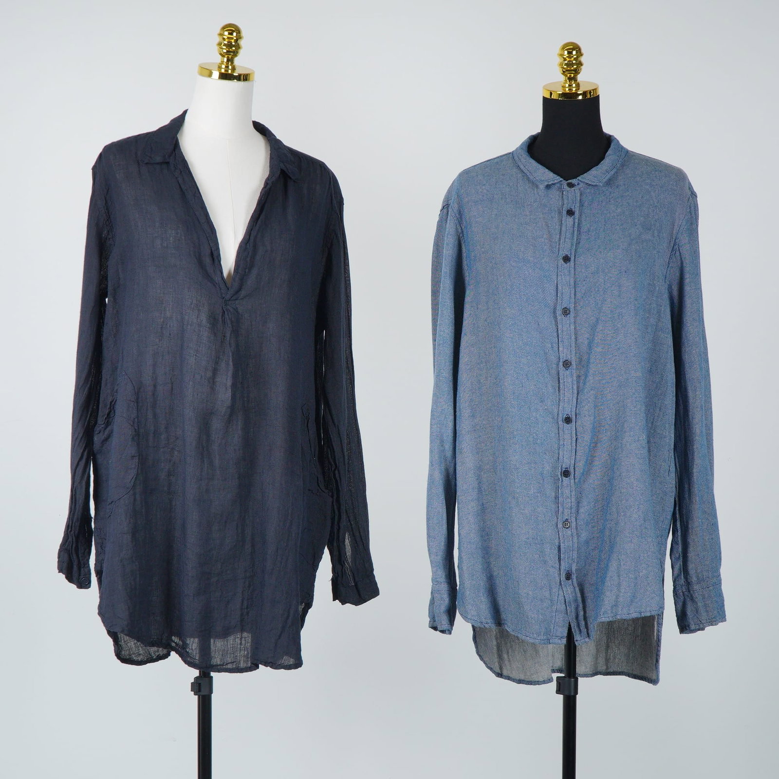 2pc CP Shades Carnie and Teton Long-Sleeved Linen Tunics: This lot features two long-sleeved tunics from the designer label CP Shades. The first garment is the Carnie style button-down shirt in blue, crafted from a textured cotton or linen-blend fabric with