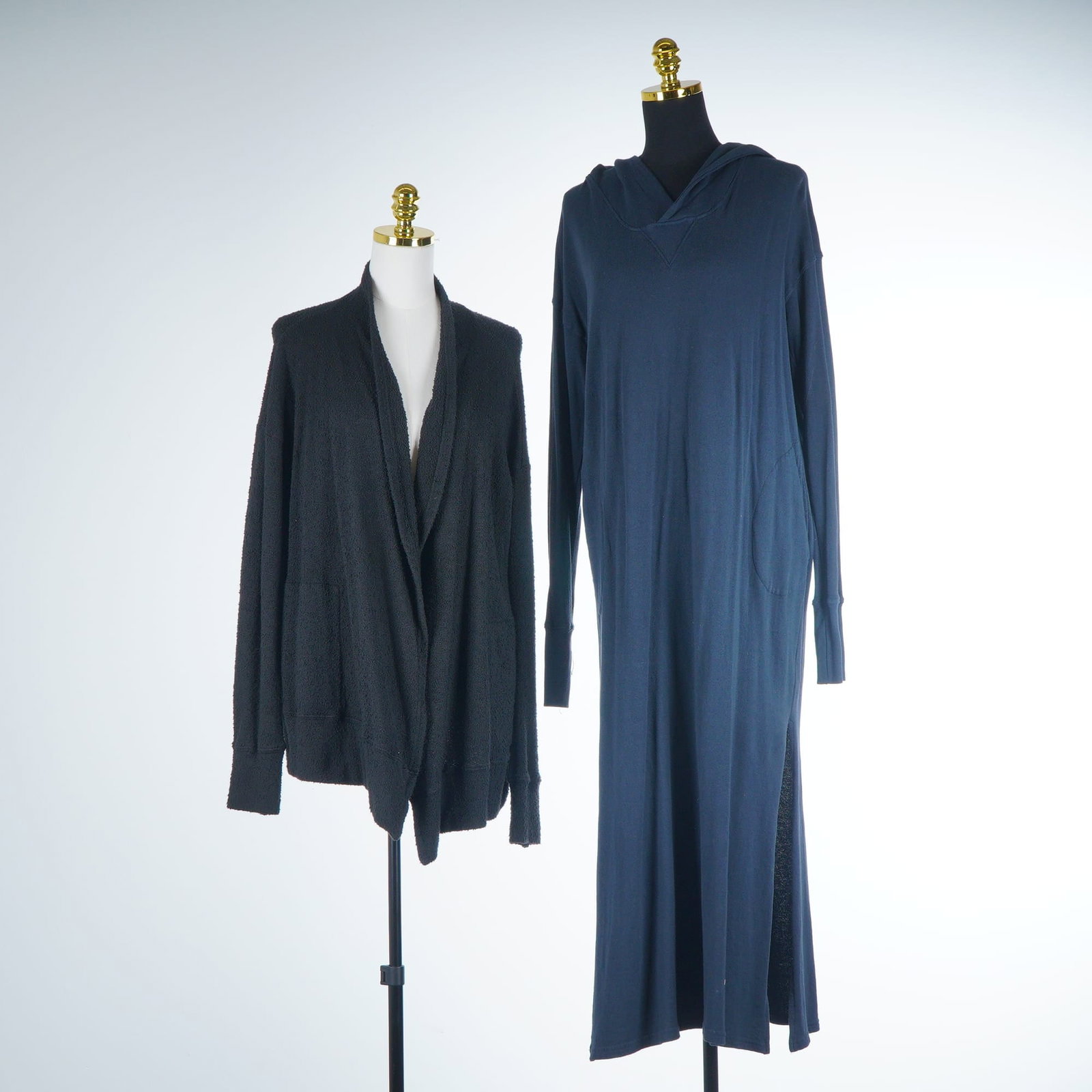 2pc CP Shades Knit Mira Cardigan & Willow Sweatshirt Hooded Maxi Dress: This lot features two contemporary knit pieces from CP Shades. The first item is the Mira cardigan, crafted in a charcoal black textured knit with an open-front silhouette, draped shawl collar, droppe