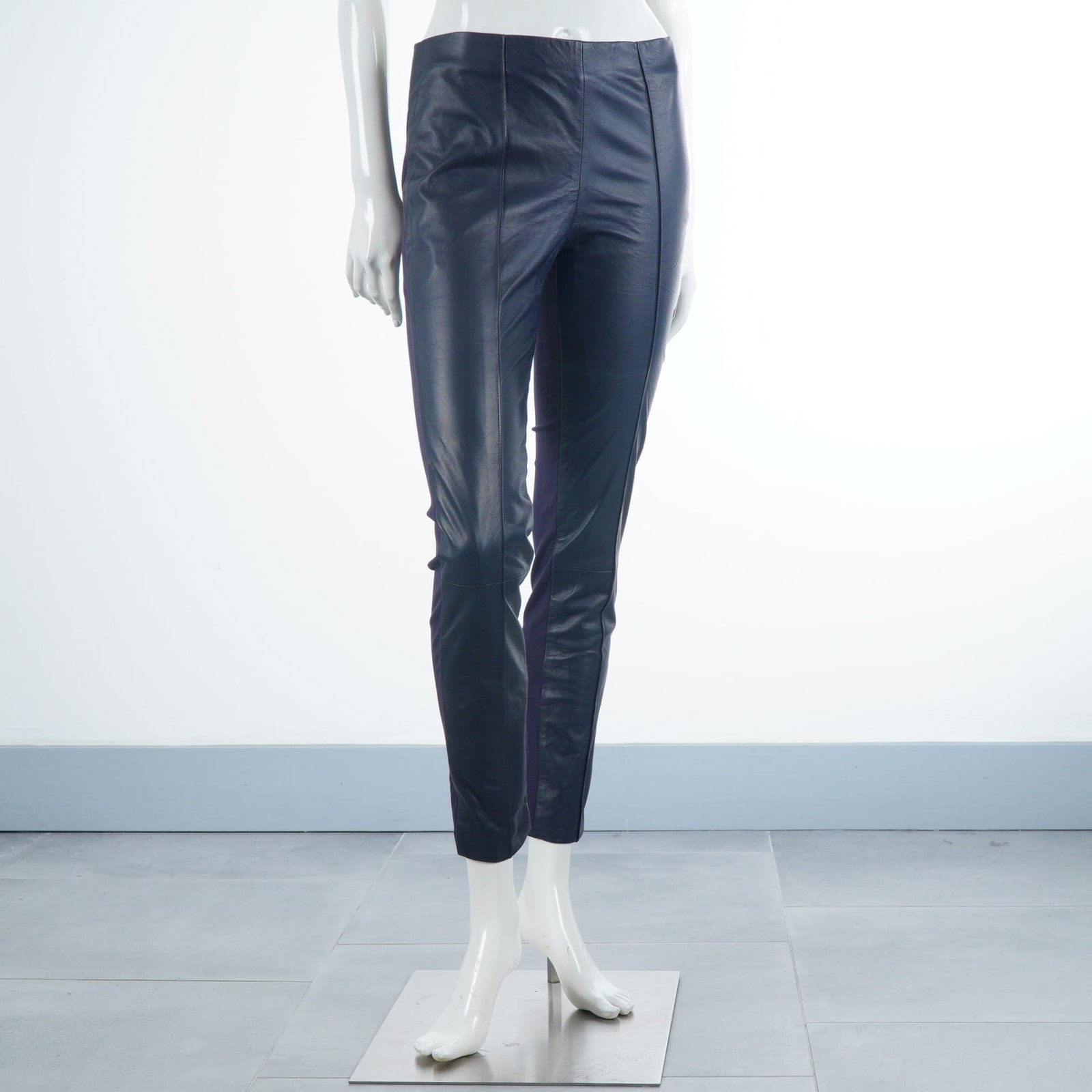 Marciano Lamb Leather Front Slim-Fit Black Pants: These slim-fit, leggings-style leather trousers by Marciano feature a mixed-media construction with smooth lamb panels on the front and a coordinating stretch knit fabric on the reverse. The design in