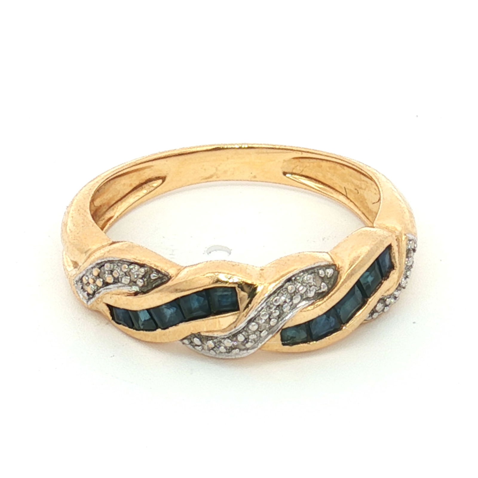 14K Gold Sapphire and Diamond Twisted Ring: Crafted from 14K yellow gold, this ring features a twisted center design. It is set with round cut diamonds and square cut sapphires. The inner band is marked 14K. Tested with Presidium Gem Tester II.
