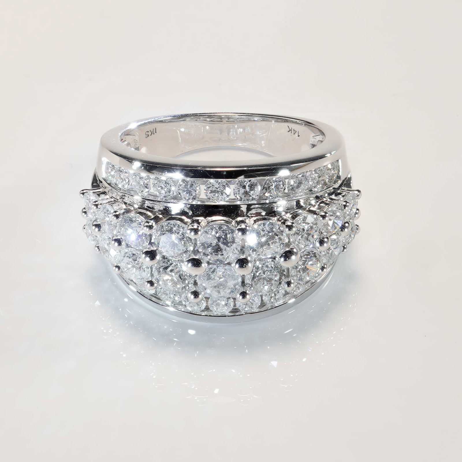 14K White Gold 3.00ctw Diamond Dome Ring: A dazzling ring set with approximately 3.00 carats total weight of round brilliant cut diamonds, arranged in a bold domed design. Forty diamonds are featured in total, with a mix of pave and prong set