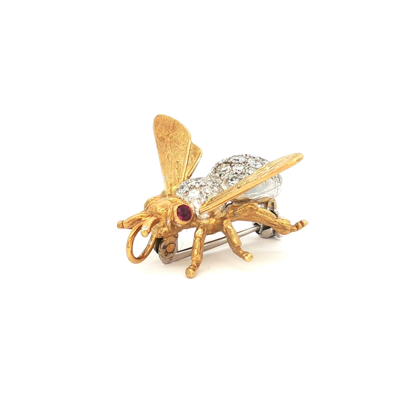 18K Gold Diamond and Ruby Bee Brooch Pendant: A brooch pendant crafted from 18K yellow and white gold, molded in the shape of a bee. The body is encrusted with small round diamonds, and the eyes are set with red rubies. The back features a pin me