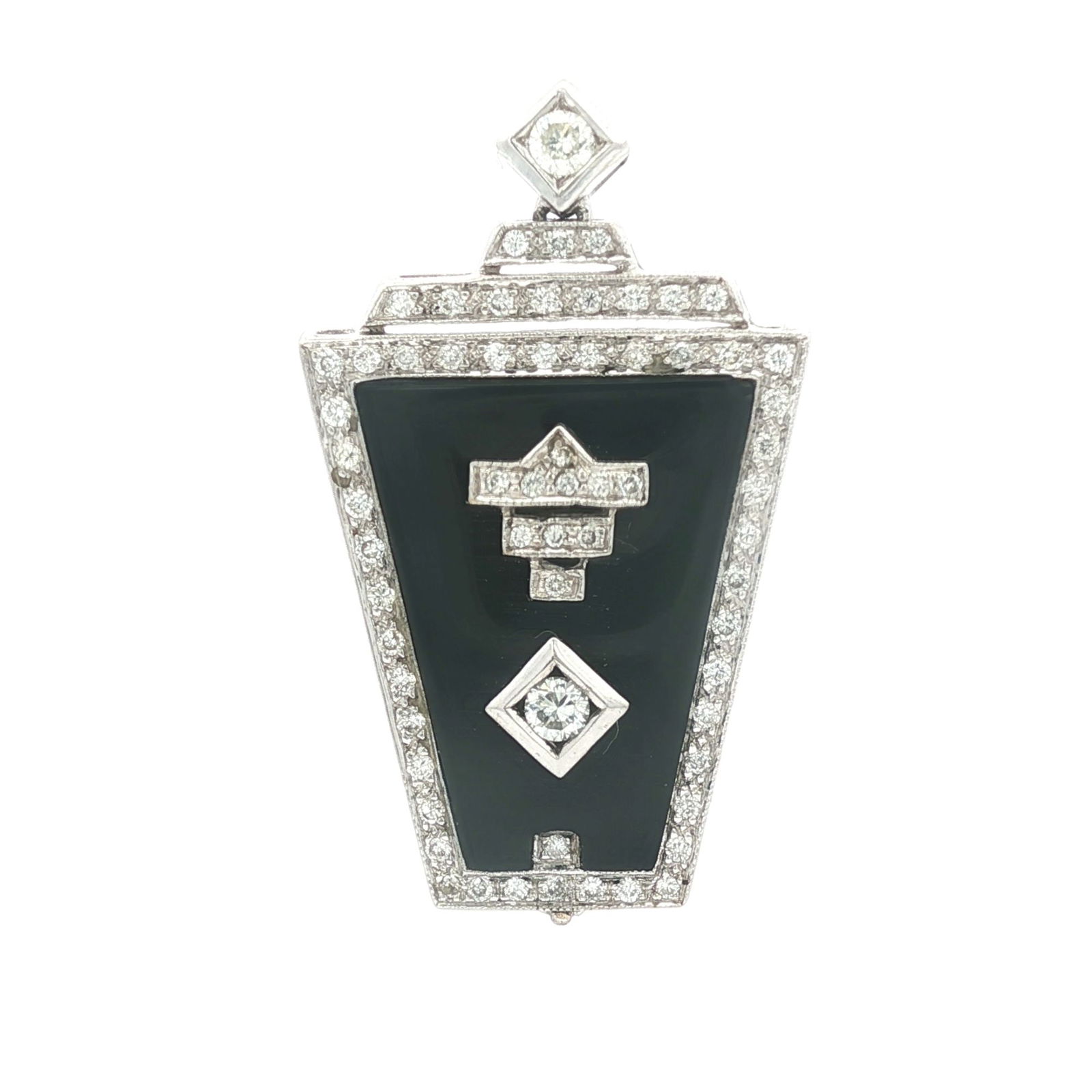 Art Deco Diamond & Onyx Pendant/Clip Dress: This manganese-iron Art Deco style pendant/clip dress features a trapezoid plaque featuring a black onyx inlay framed by a pierced geometric border set with diamonds. The center motif displays a arrow
