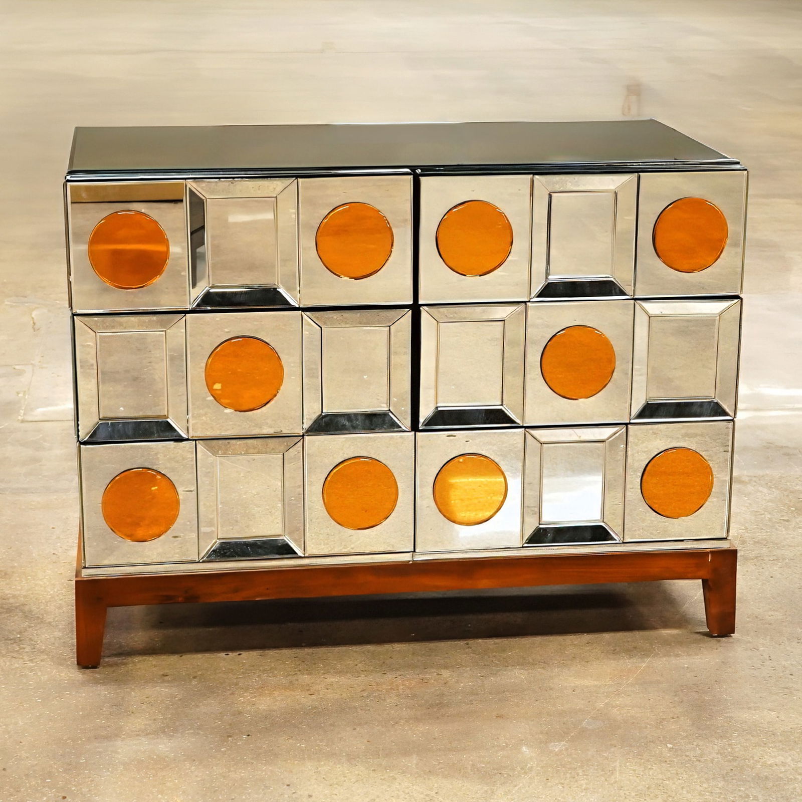 Olivier de Schrijver Mirrored Cabinet with Mahogany Feet, Special Oliver: This cabinet, the Special Oliver model by Olivier de Schrijver, features a case fully clad in clear mirrored glass. The facade is configured with two doors adorned with a grid of square mirrored panel