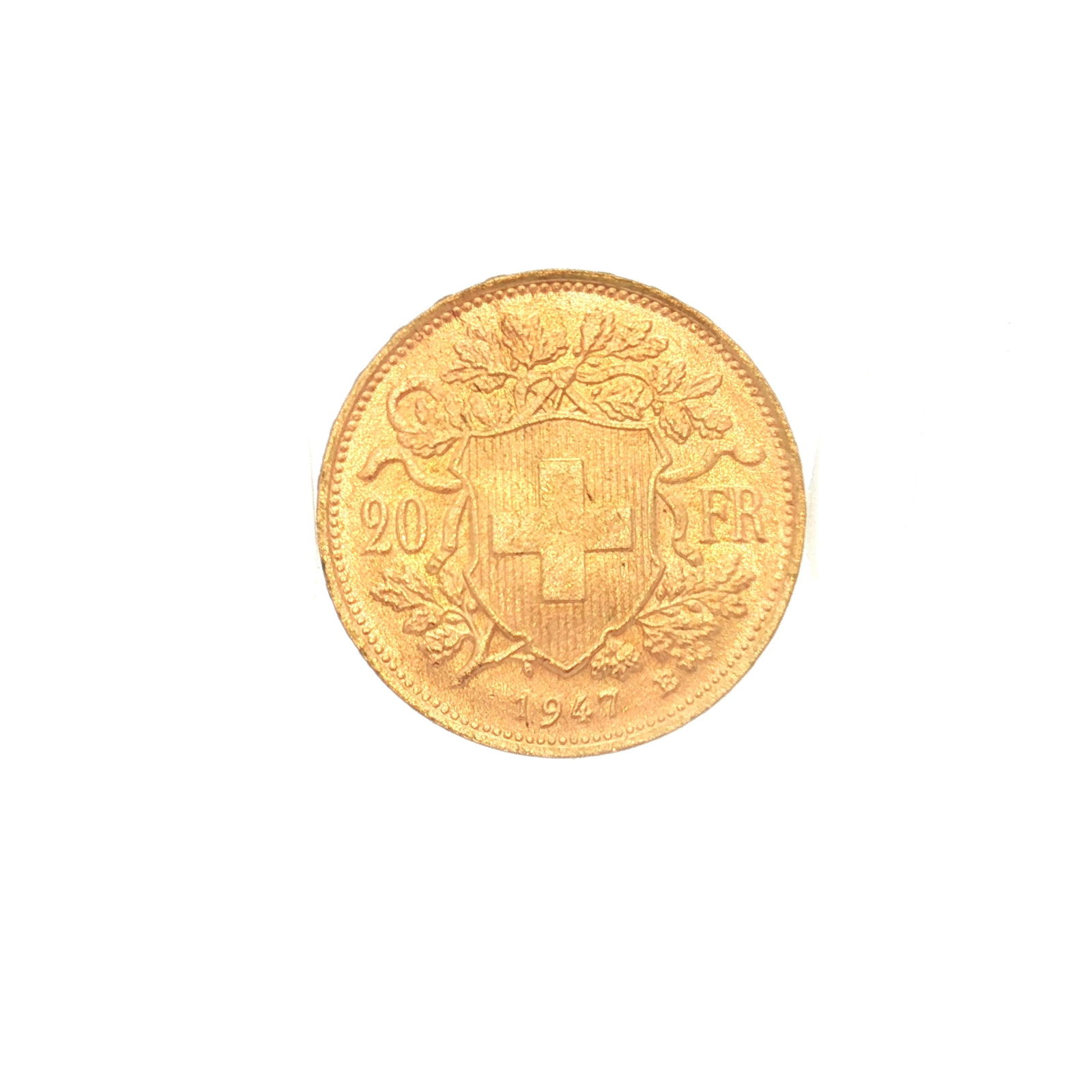 1935 Switzerland 20 Francs Vreneli Gold Coin: Minted by Bern, Switzerland. The obverse depicts bust of young woman left-facing with tresses and a garland of edelweiss. The reverse displays Coat of Arms and Oak (Quercus robur) branch with acorns a