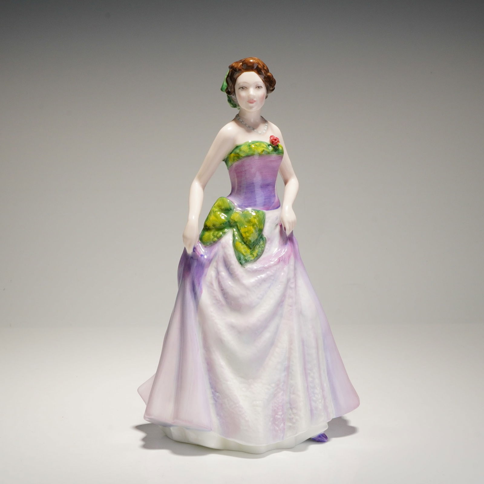 Royal Doulton Jessica HN3850 Figure of the Year 1997: A single glazed porcelain figurine titled 'Jessica,' produced by Royal Doulton as the Figure of the Year for 1997, model number HN 3850. The figurine depicts a standing woman in a sweeping, strapless