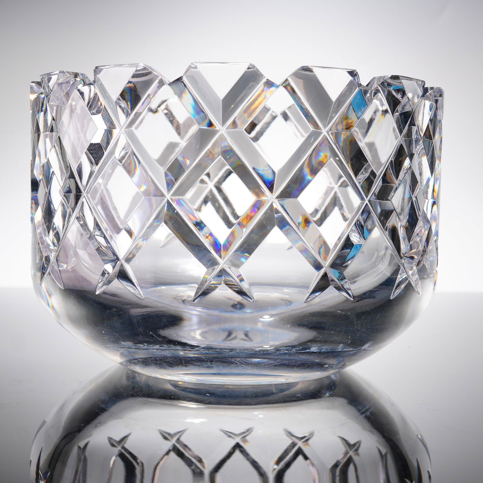 Orrefors So??ero Crystal Bowl: A single piece of clear crystal, likely the polished base or underside of a sculptural vessel or ornament. The material is heavy and highly refractive. The base features etched markings of Orrefors ba