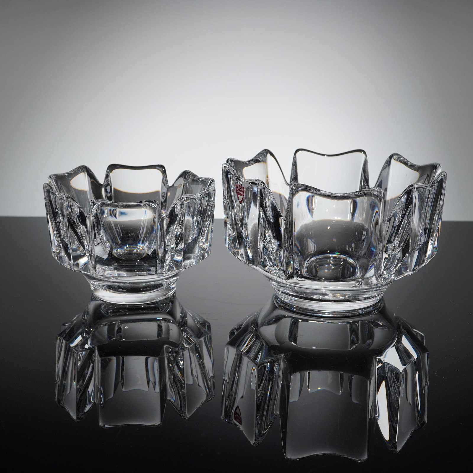 Two Orrefors Crystal Corona Bowls: Corona bowls with paneled crystal sides on footed base. Orrefors etched mark on base of both. Dimensions5.50"W x 3.75"H