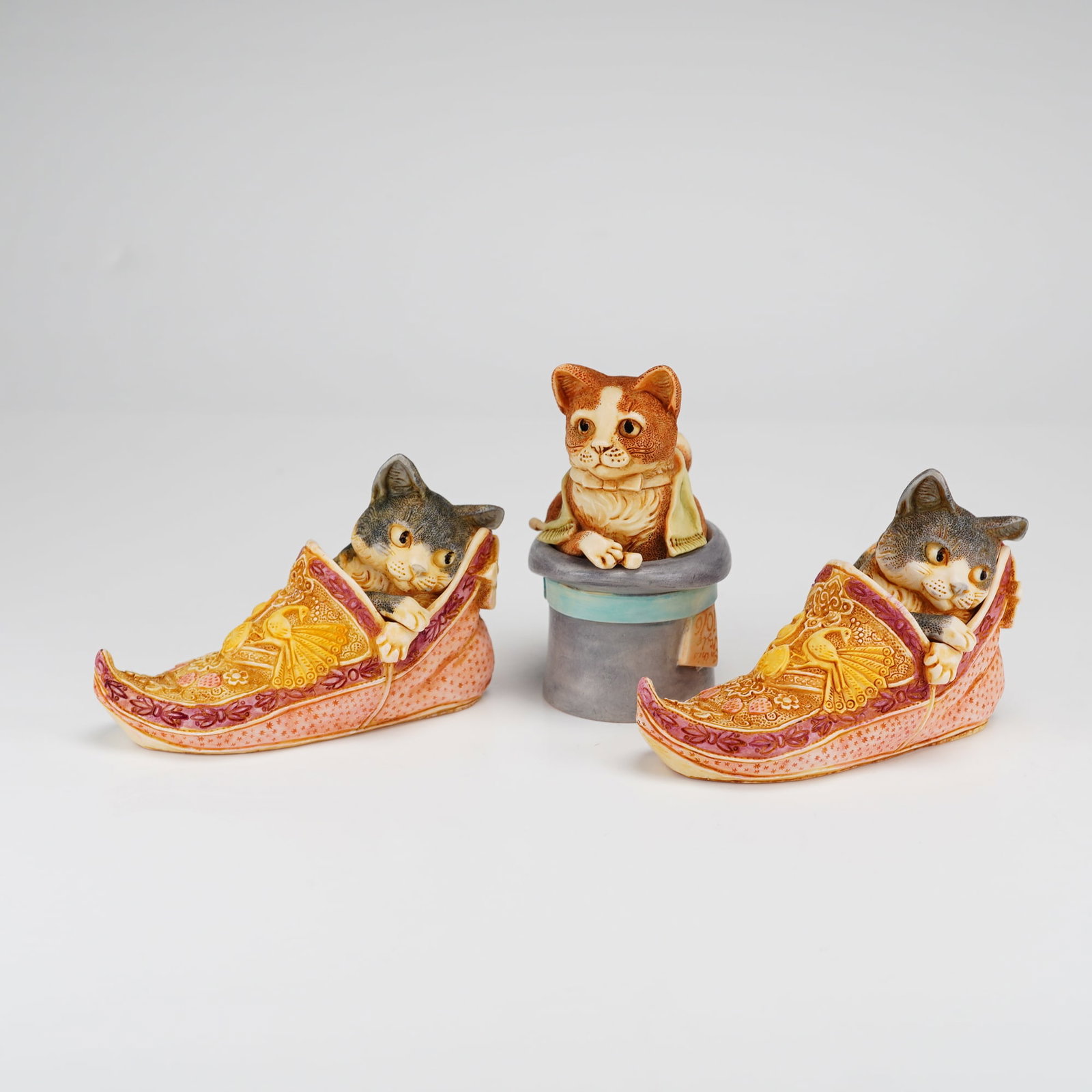 3pc Harmony Kingdom Trinket Boxes, Cherubini and Sharazade: This collection consists of three Harmony Kingdom Treasure Jests jewelry boxes, including one Cherubini and two Sharazade figurines. The Cherubini figurine features an orange and white tabby cat seate