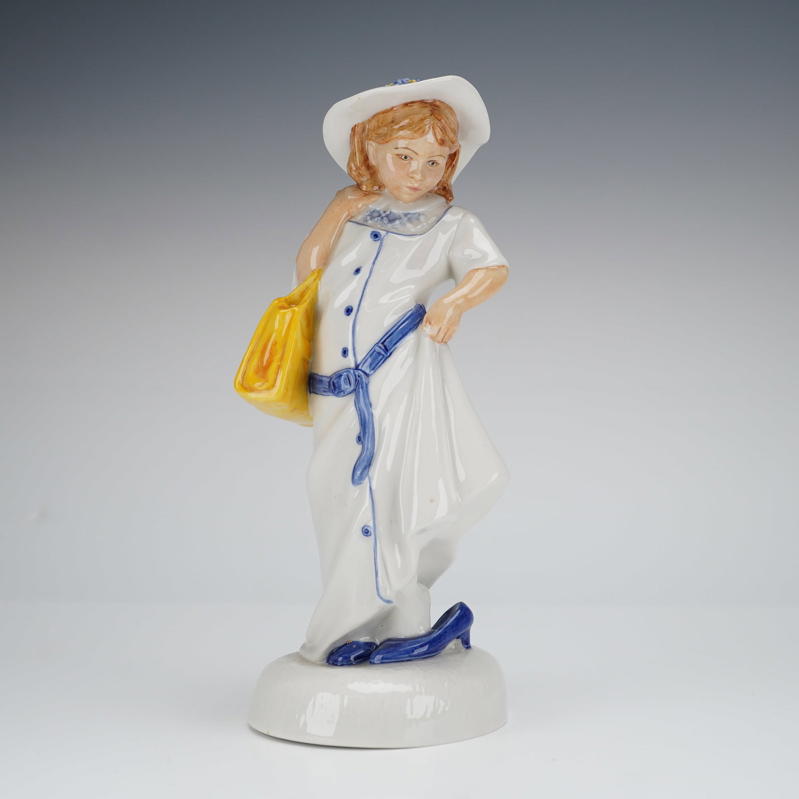 Royal Doulton Childhood Days Dressing Up HN2964 Figurine: A single glazed bone china figurine by Royal Doulton, titled 'Dressing Up,' model number HN 2964, from the 'Childhood Days' series. The figure depicts a young girl in a long, white, hand-painted coat