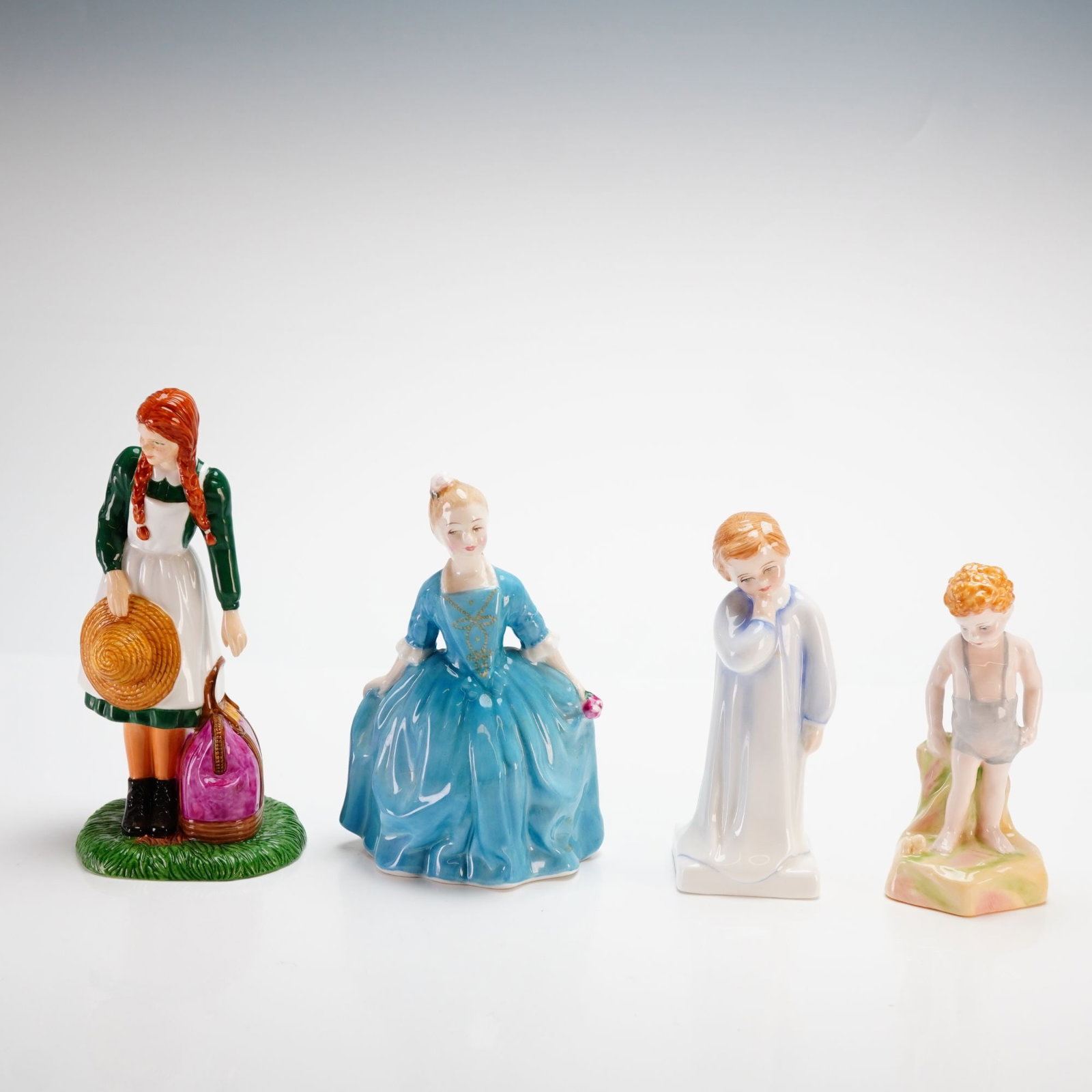 Royal Doulton, Anne Arrives at Green Gables and Child Figurines: This professional collection of 4pc Royal Doulton figurines features hand-painted bone china subjects. The centerpiece is "Anne Arrives at Green Gables" (HN 5225), a limited edition piece numbered 349