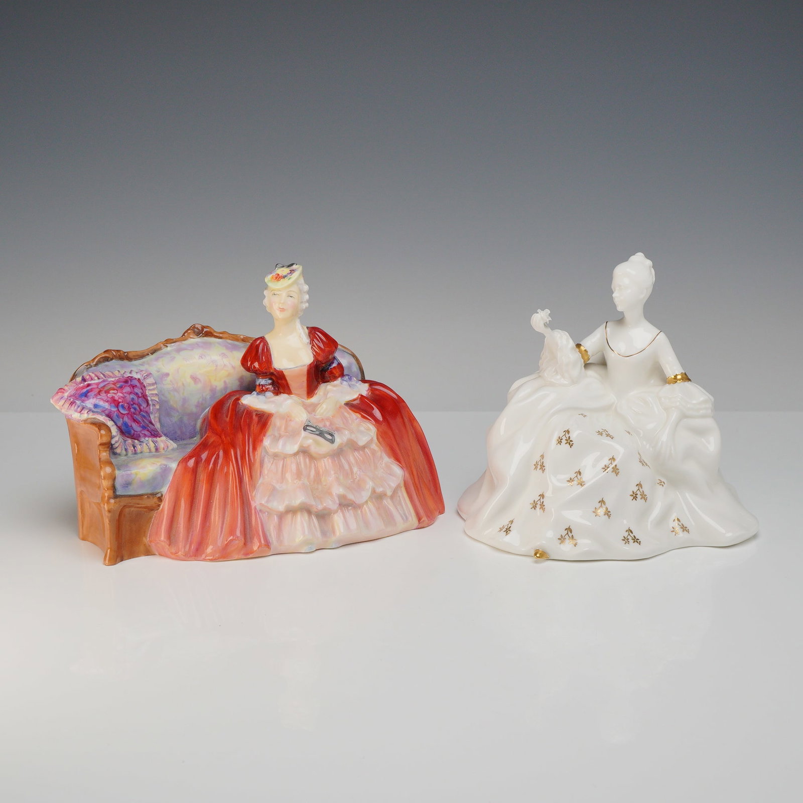 2pc Royal Doulton Figurines Belle of the Ball and Arrietty: This lot comprises 2 rdf (Royal Doulton figurines) crafted in fine bone china. The first figurine is Belle of the Ball, model number HN 1997, designed by Leslie Harradine. It depicts a woman in an 18t