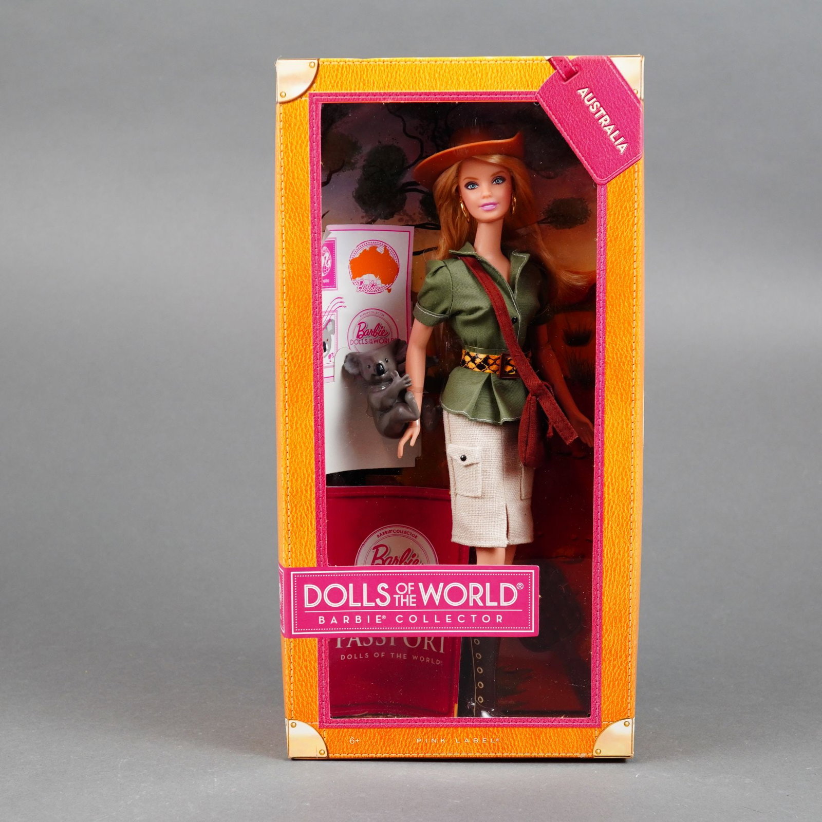 Mattel Barbie Collector Dolls of the World Australia Doll, 11.5 Inches: Mattel Barbie Collector Pink Label doll from the Dolls of the World collection, representing Australia. This 2011 edition vinyl doll features a standard articulated body with rooted strawberry-blonde