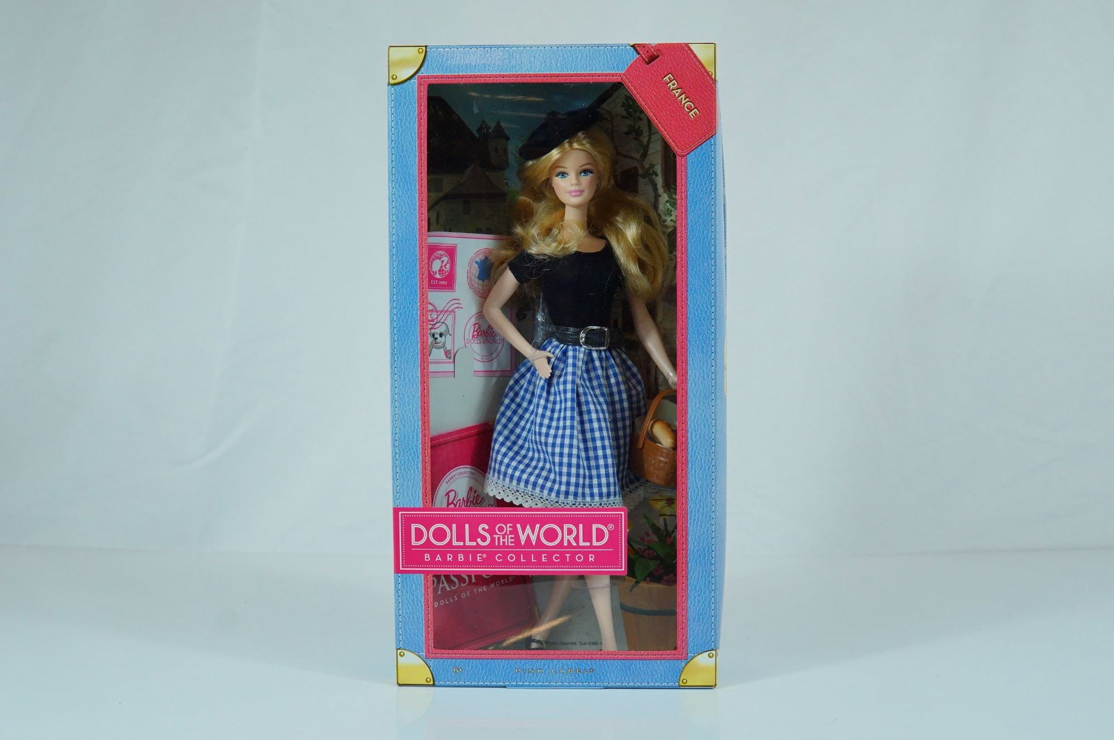 Mattel Barbie Dolls of the World France Barbie Doll, 11.5 Inches: Manufactured by Mattel, this vinyl fashion doll is part of the Dolls of the World Barbie Collector Pink Label series, model number X8420. The doll features rooted blonde synthetic hair styled in waves
