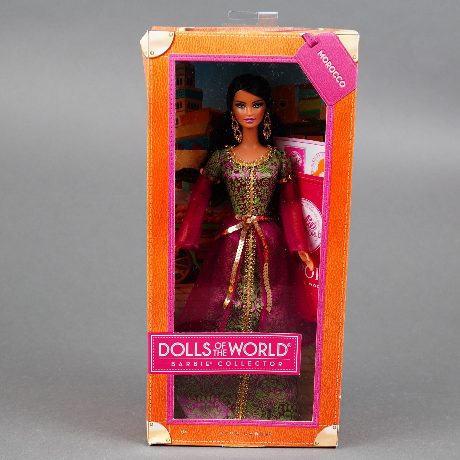 Mattel Morocco Barbie Doll, Dolls of the World Passport Series, 11.5 inches: Produced by Mattel, Inc., this 2012 Pink Label collector doll is part of the Dolls of the World Passport Series. The vinyl doll features the Lara head sculpt with rooted dark brown synthetic hair and