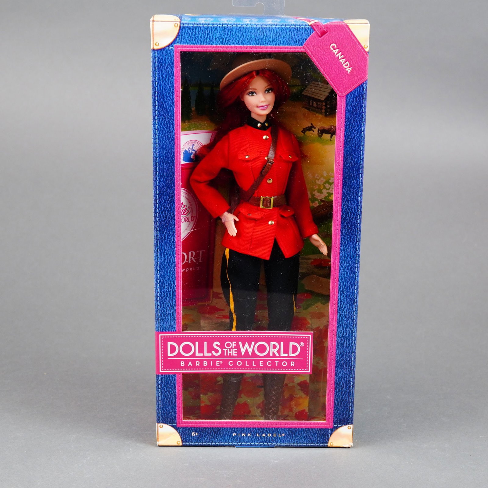 Mattel, Barbie Collector Dolls of the World Canada Barbie, 11.5 Inches: Manufactured by Mattel, this vinyl fashion doll is part of the Dolls of the World Pink Label collection, released in 2012. The doll features rooted auburn hair and stationary painted blue eyes. She is