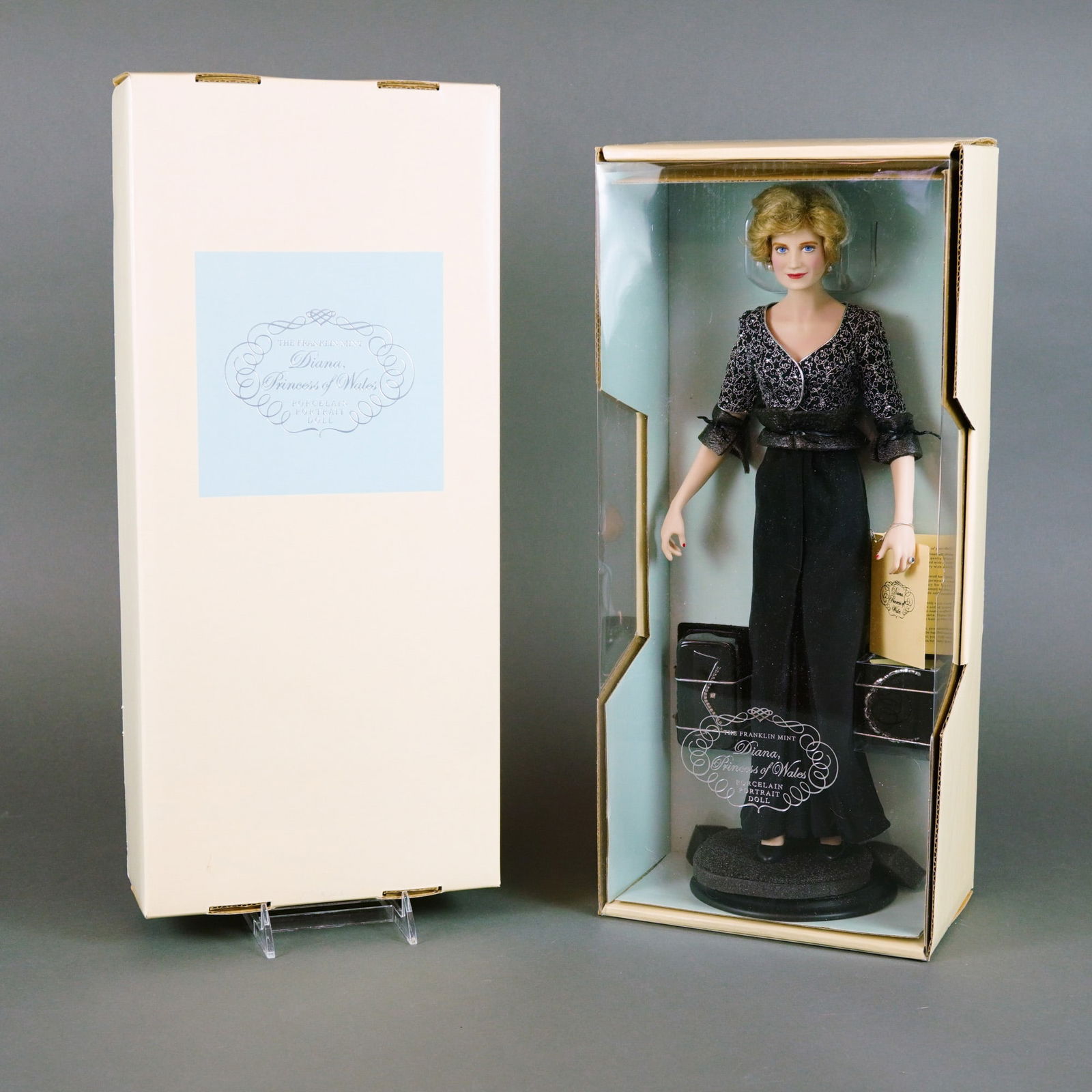 The Franklin Mint Diana, Princess of Wales Porcelain Portrait Doll, 17.5 Inches: Produced by The Franklin Mint, this Diana, Princess of Wales Porcelain Portrait Doll is crafted with a fine porcelain head, limbs, and torso. The doll features hand-painted blue fixed eyes with detail