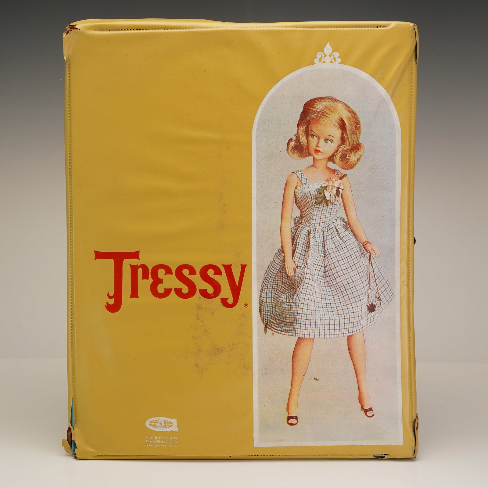 3pc American Character Tressy and Cricket Dolls with Case: This collection features three vintage vinyl fashion dolls manufactured by American Character of Brooklyn, NY. The set includes two Tressy dolls and her younger cousin, Cricket. Each doll is equipped