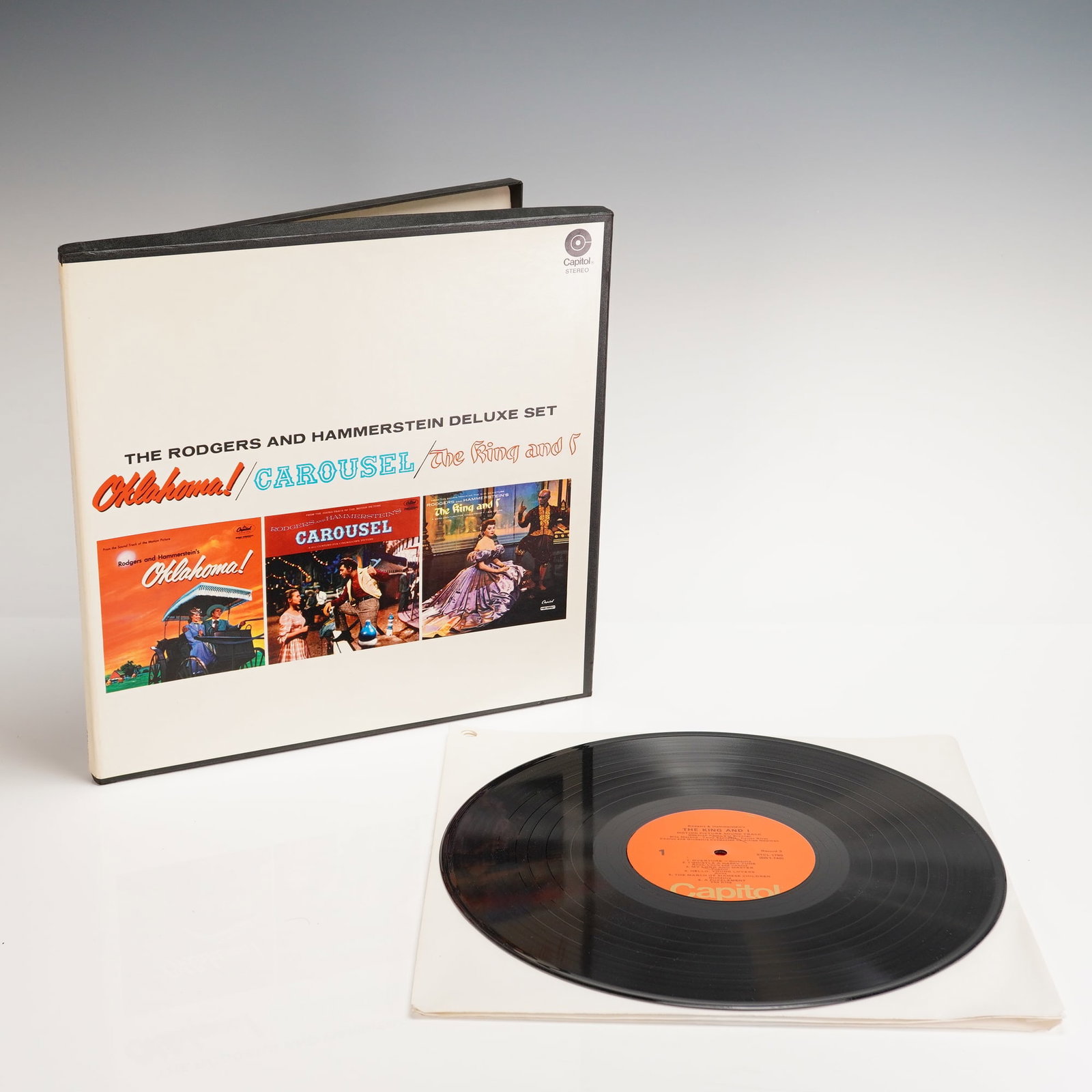 Rodgers and Hammerstein Deluxe 3 LP Box Set: A vintage boxed set slipcase titled THE RODGERS AND HAMMERSTEIN DELUXE SET, produced by Capitol Records. The cardboard box features cover art reproductions for the three musicals intended for the set: