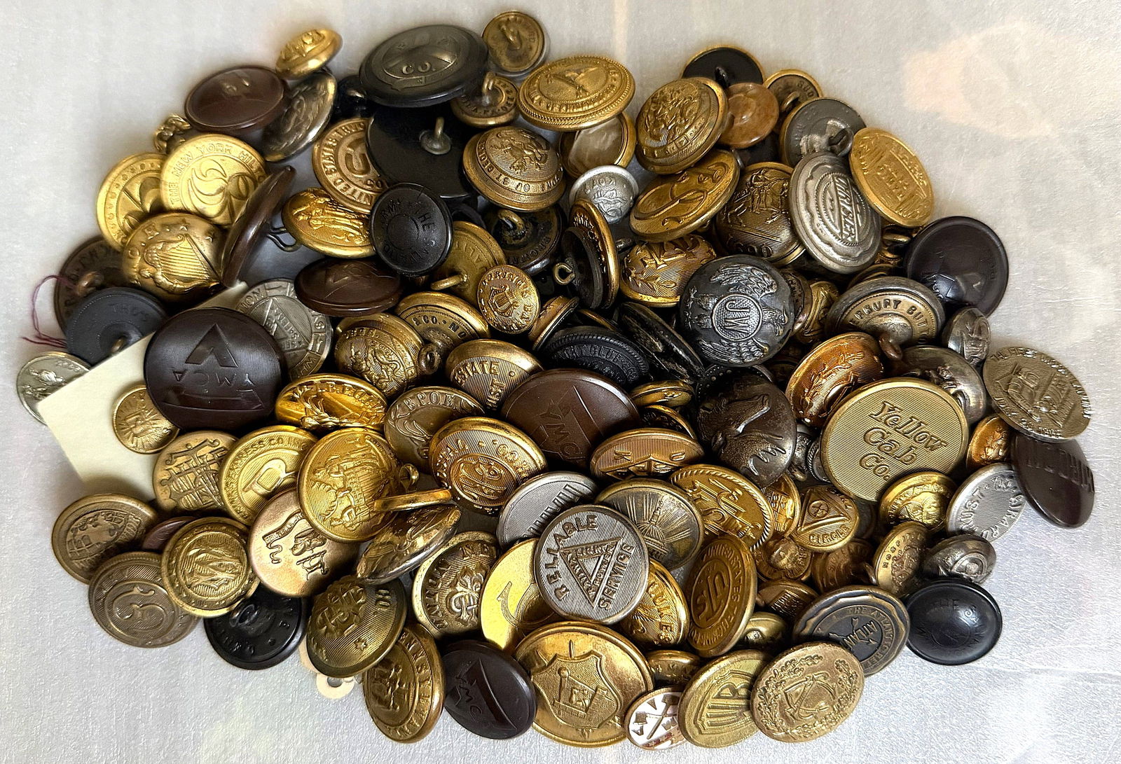 A MIXED BAG LOT OF ASSORTED UNIFORM BUTTONS: Mostly division one with some later examples. DimensionsSM=Less than 3/4", Medium=3/4" to 1 1/4". Large=1 1/4" and above, extra large=1 3/4" and above Date or EraDIVISION 1=PRE 1918 AND DIVISION 3