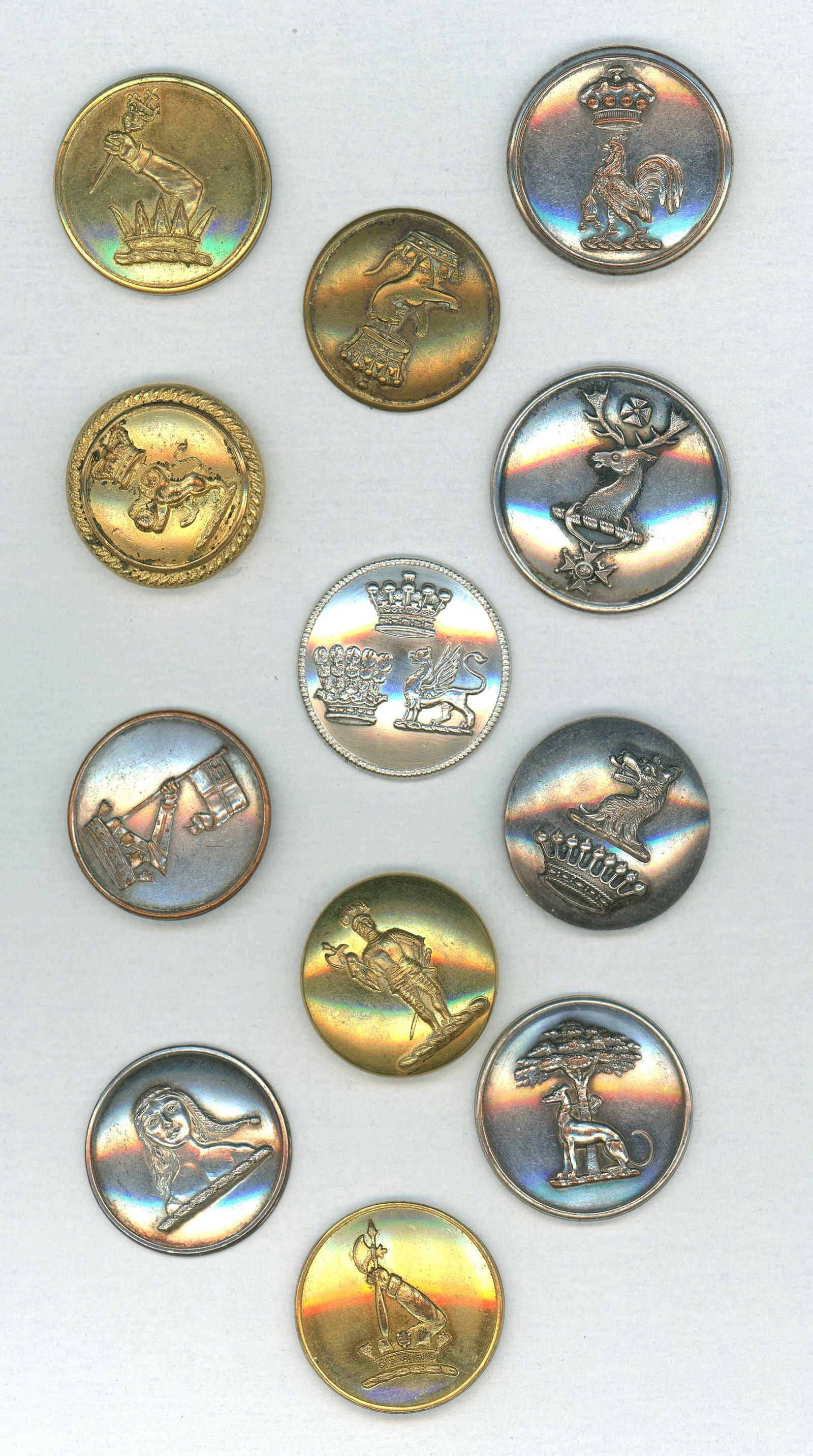 A SMALL CARD OF DIVISION ONE ENGLISH LIVERY BUTTONS: 12 Medium 19th C. examples with different subject matter. DimensionsSM=Less than 3/4", Medium=3/4" to 1 1/4". Large=1 1/4" and above, extra large=1 3/4" and above Date or EraDIVISION 1=PRE 1918 AND