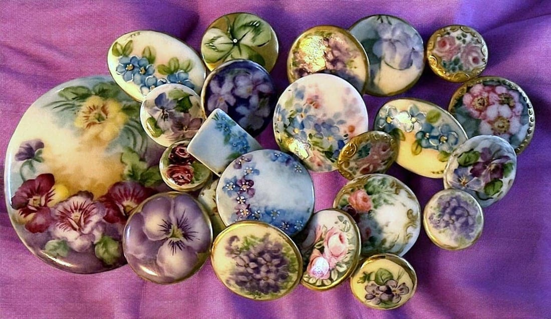 A BAG LOT OF DIVISION 1 HAND PAINTED PORCELAIN BUTTONS: This large selection of early 20th century are stud examples. DimensionsSM=Less than 3/4", Medium=3/4" to 1 1/4". Large=1 1/4" and above, extra large=1 3/4" and above Date or EraDIVISION 1=PRE 1918 AN
