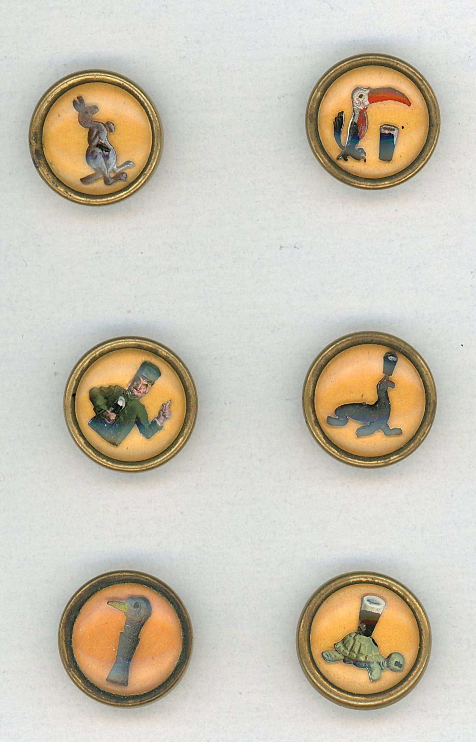A SMALL CARD OF BRAND RELATED ADVERTISING BUTTONS: 6 Small oval 20th century examples of the Guiness Beer Co. DimensionsSM=Less than 3/4", Medium=3/4" to 1 1/4". Large=1 1/4" and above, extra large=1 3/4" and above Date or EraDIVISION 1=PRE 1918 AND