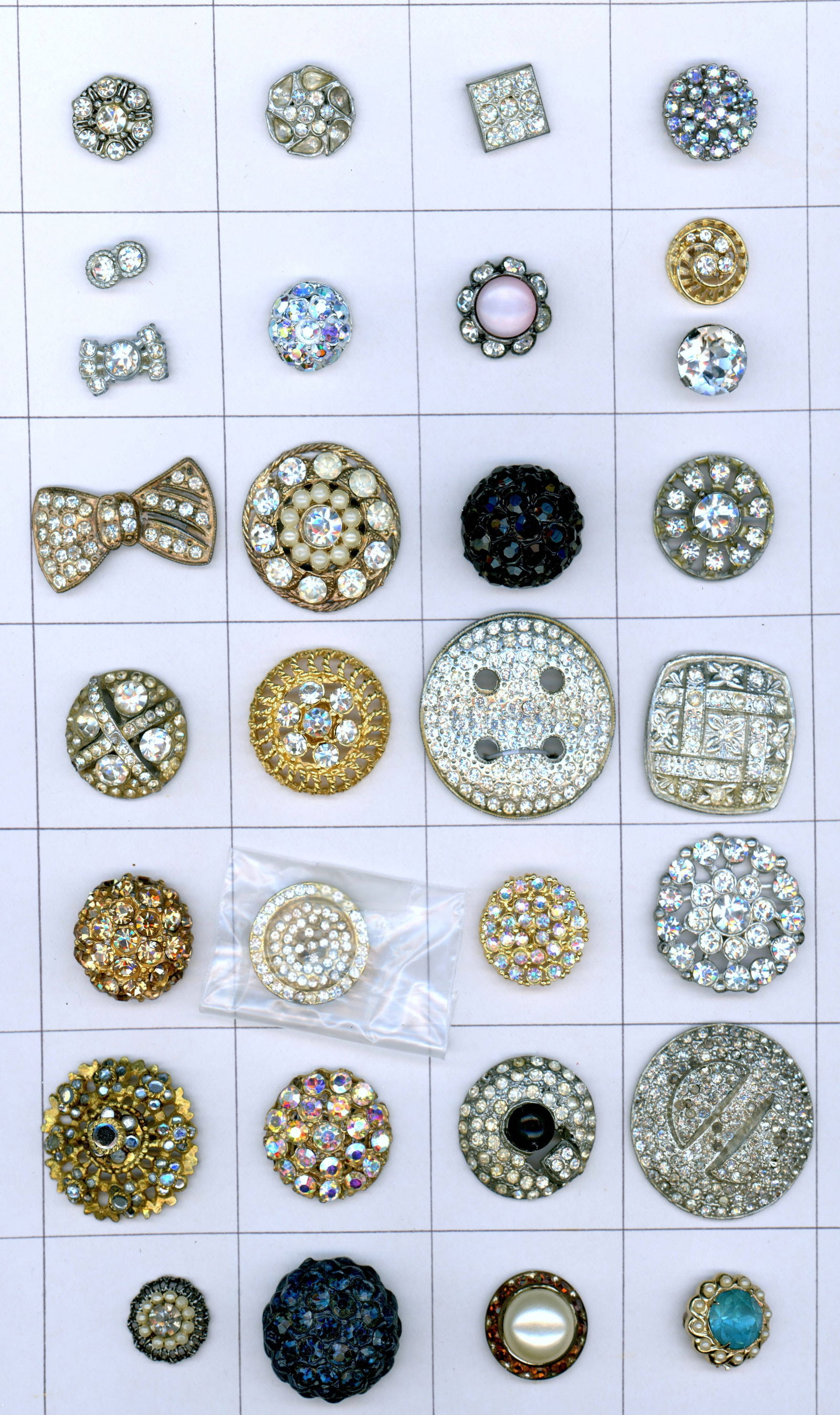 A CARD OF DIVISION 1 & 3 "GLITZY" BUTTONS: 30 S/M/L 19th/20th century assorted shapes and pattern examples. DimensionsSM=Less than 3/4", Medium=3/4" to 1 1/4". Large=1 1/4" and above, extra large=1 3/4" and above Date or EraDIVISION 1=PRE