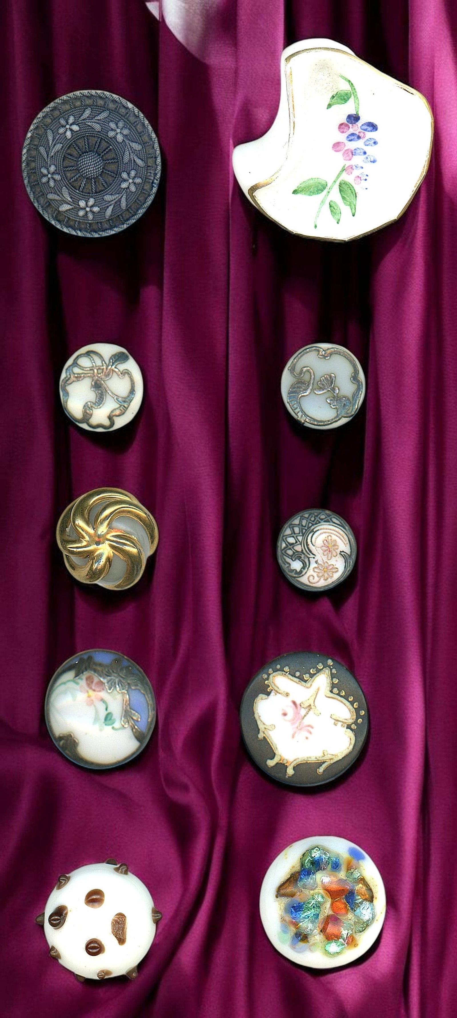 A SMALL CARD OF DIVISION ONE GLASS BUTTONS: 10 S/M/L late 19th & early 20th C. examples specialized to white. This lot includes silver overlay examples, paint DF, shapes, tinted lacy style, Victorian and more, from the collection of Nikki Deal.