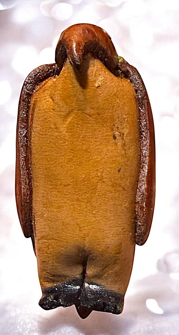 A DIVISION THREE REALISTIC LEATHER BUTTON: 1 Large 21st century crafted and tooled leather Penguin example. DimensionsSM=Less than 3/4", Medium=3/4" to 1 1/4". Large=1 1/4" and above, extra large=1 3/4" and above Date or EraDIVISION 1=PRE 1918