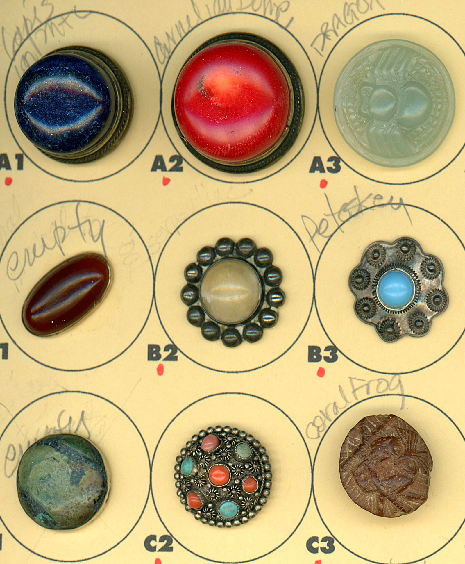 A PARTIAL CARD OF DIVISION 1 & 3 GEMSTONE BUTTONS: 9 Medium/Large 19th/20th century assorted semi precious examples. DimensionsSM=Less than 3/4", Medium=3/4" to 1 1/4". Large=1 1/4" and above, extra large=1 3/4" and above Date or EraDIVISION 1=PRE