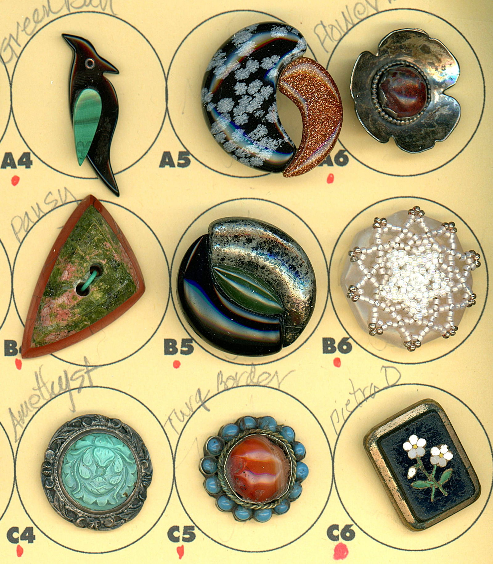 A PARTIAL CARD OF DIVISION 1 & 3 GEMSTONE BUTTONS: 9 Medium/Large 19th/20th century assorted semi precious examples. DimensionsSM=Less than 3/4", Medium=3/4" to 1 1/4". Large=1 1/4" and above, extra large=1 3/4" and above Date or EraDIVISION 1=PRE