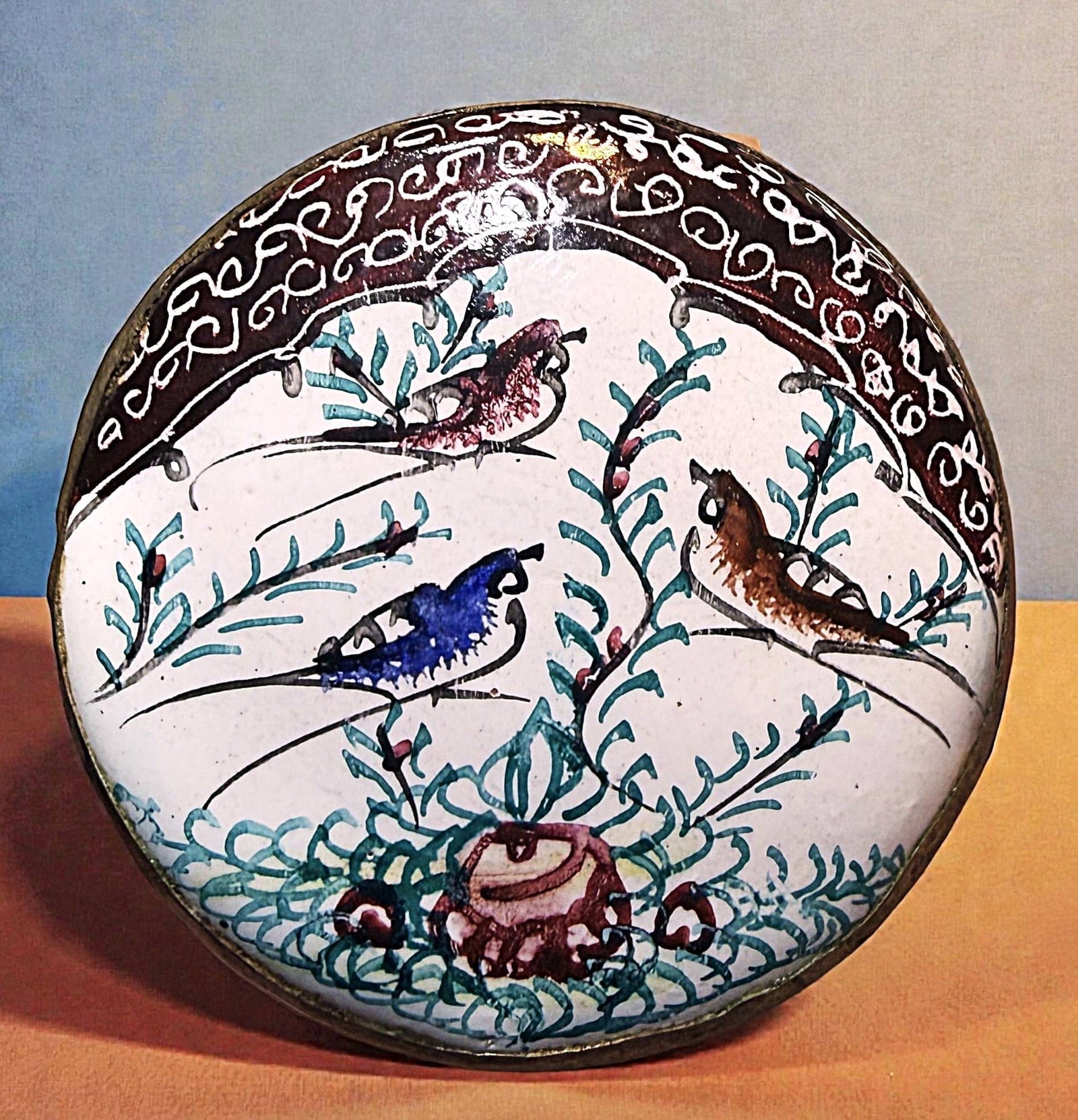 A DIVISION THREE COLORFUL PICTORIAL ENAMEL BUTTON: 1 Large 20th century Persian enamel depicting birds. DimensionsSM=Less than 3/4", Medium=3/4" to 1 1/4". Large=1 1/4" and above, extra large=1 3/4" and above Date or EraDIVISION 1=PRE 1918 AND