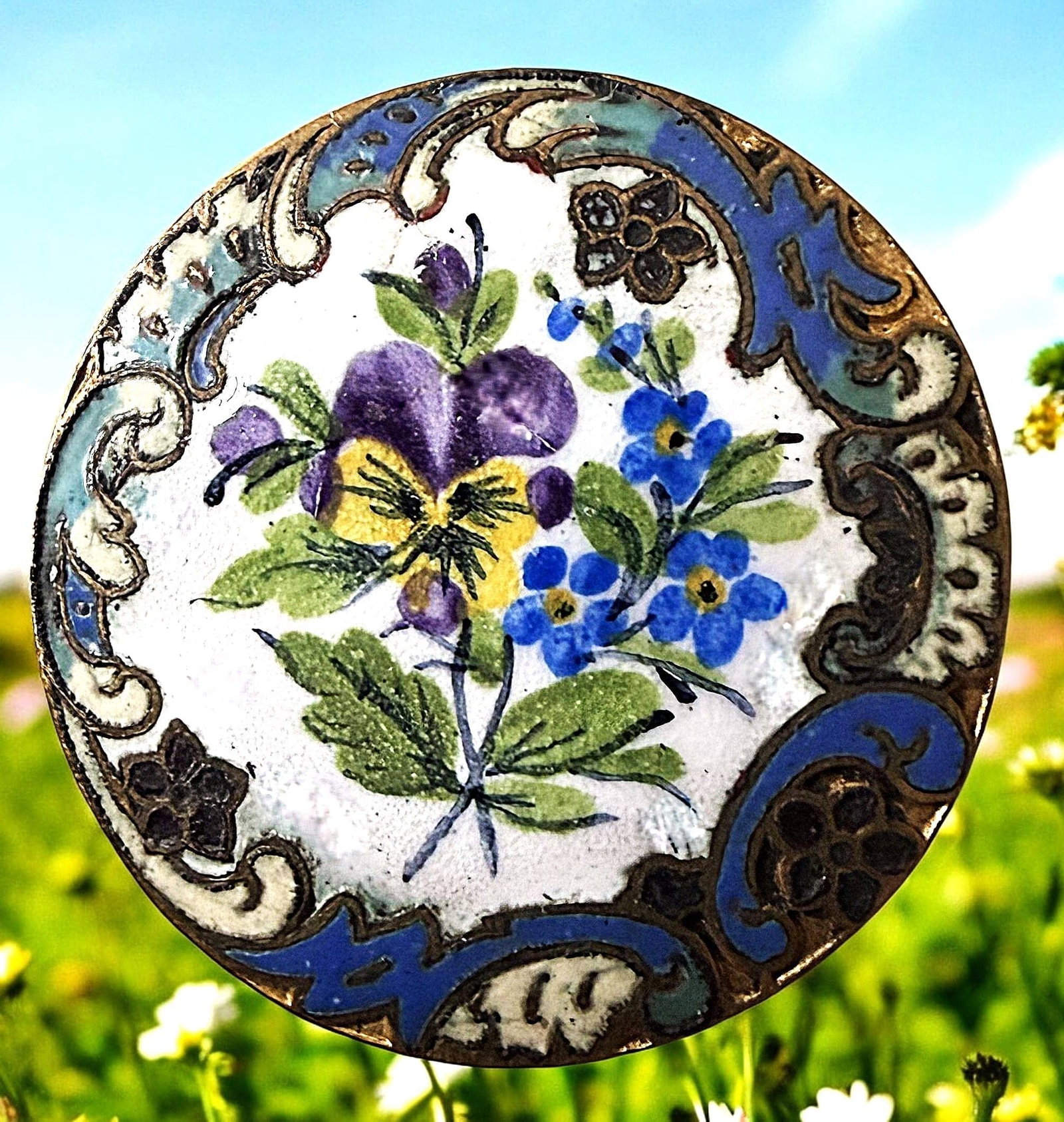 A DIVISION ONE MULTIPLE TECHNIQUE ENAMEL BUTTON: 1 Large 19th century Pansies in emaux peints & champleve example. DimensionsSM=Less than 3/4", Medium=3/4" to 1 1/4". Large=1 1/4" and above, extra large=1 3/4" and above Date or EraDIVISION 1=PRE