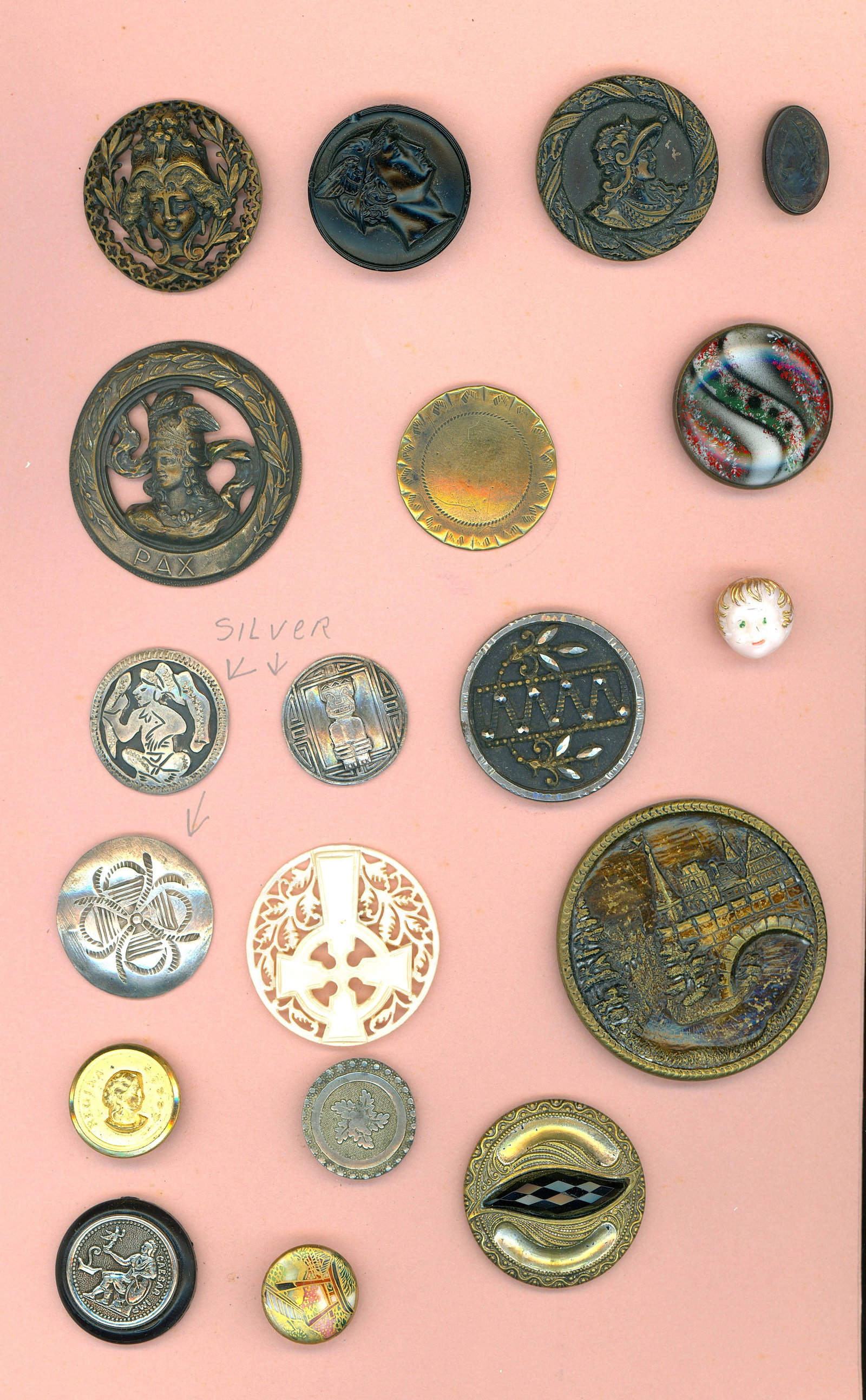 A SMAL CARD OF DIVISION 1 & 3 ASSORTED MATERIAL BUTTONS: 19 S/M/L 19th/20th century examples including Bethlehem pearl. DimensionsSM=Less than 3/4", Medium=3/4" to 1 1/4". Large=1 1/4" and above, extra large=1 3/4" and above Date or EraDIVISION 1=PRE 1918 A
