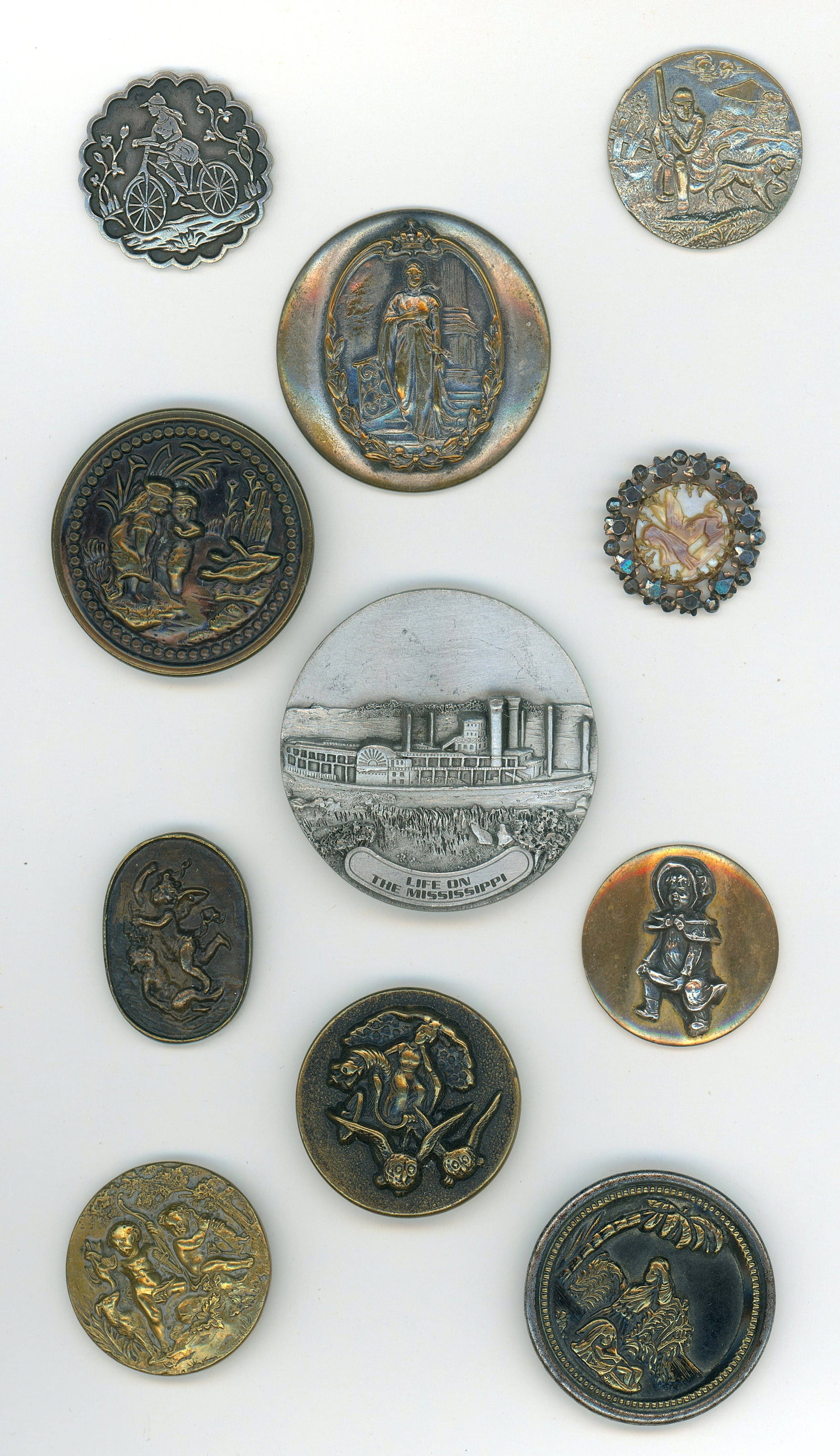 A SMALL CARD OF DIVISION ONE AND THREE PICTURE BUTTONS: 11 Medium/Large 19th/20th C. examples including Battersea Pewter. DimensionsSM=Less than 3/4", Medium=3/4" to 1 1/4". Large=1 1/4" and above, extra large=1 3/4" and above Date or EraDIVISION 1=PRE